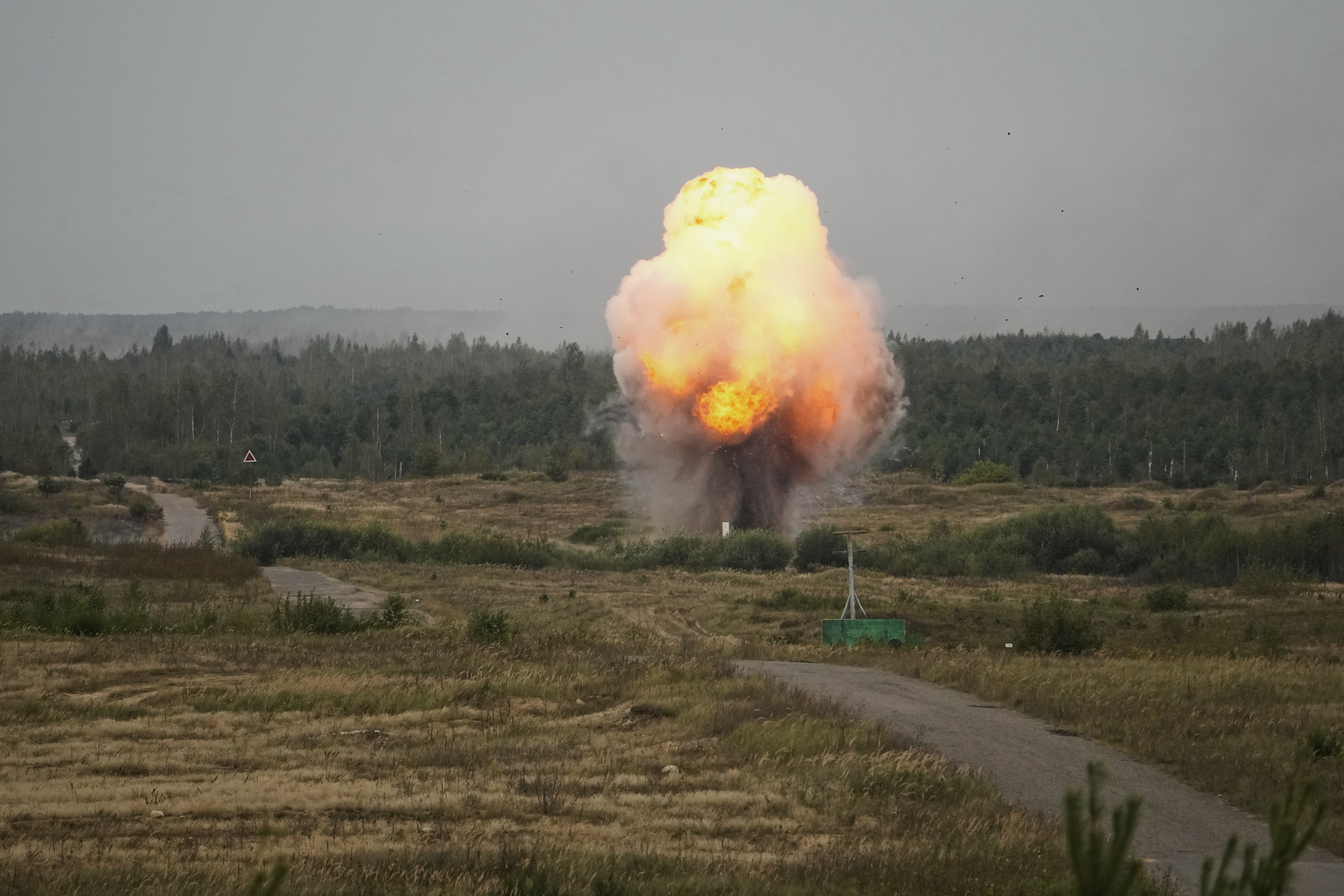 Explosions are seen during joint Russian-Belarusian military drills at a training ground near Barysaw, Belarus, Monday, Sept. 15, 2025. (Pavel Bednyakov - AP)