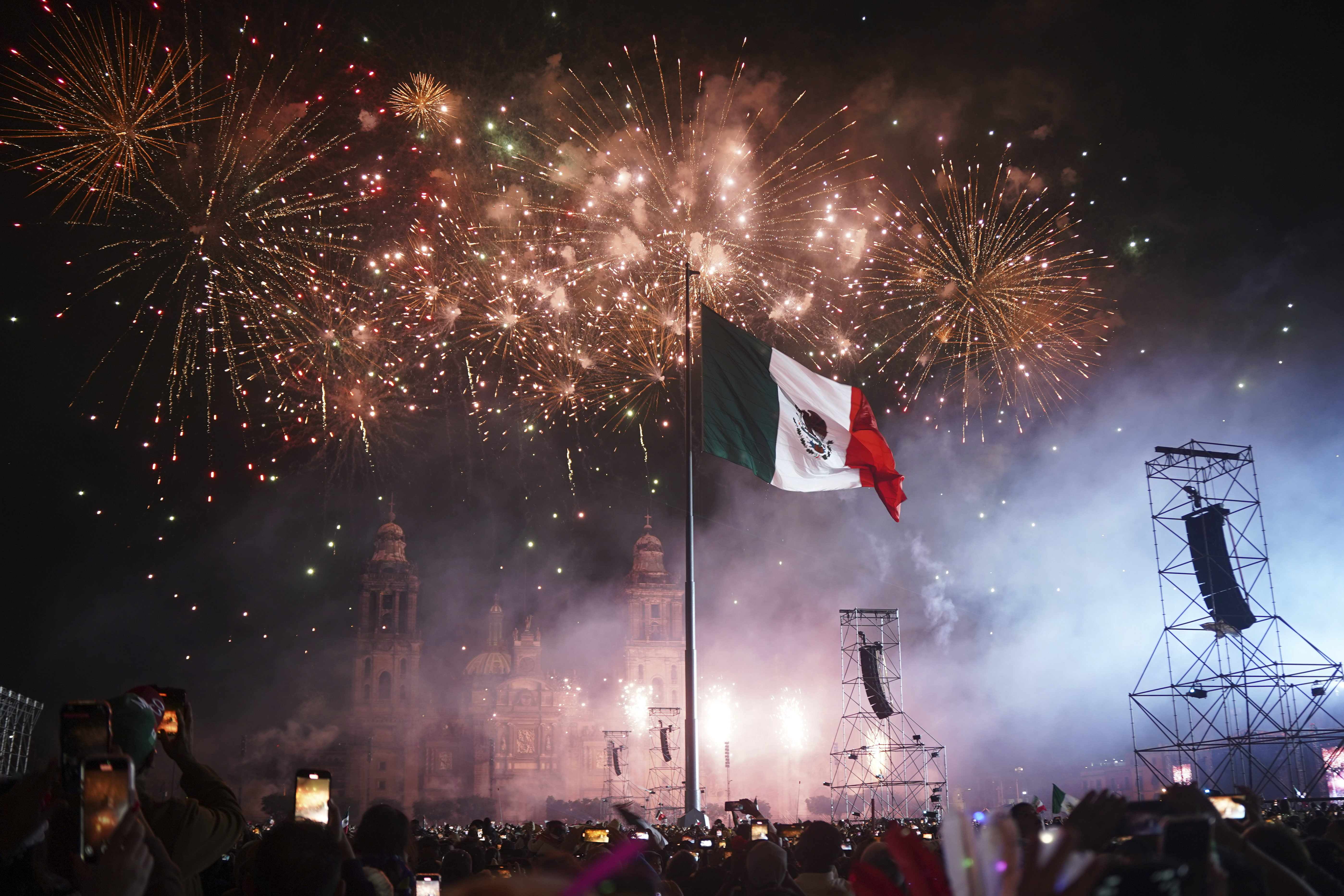 People watch fireworks during the Independence Day celebration at the Zocalo, Mexico City's main square, Monday, Sept. 15, 2025. (Jon Orbach - AP)