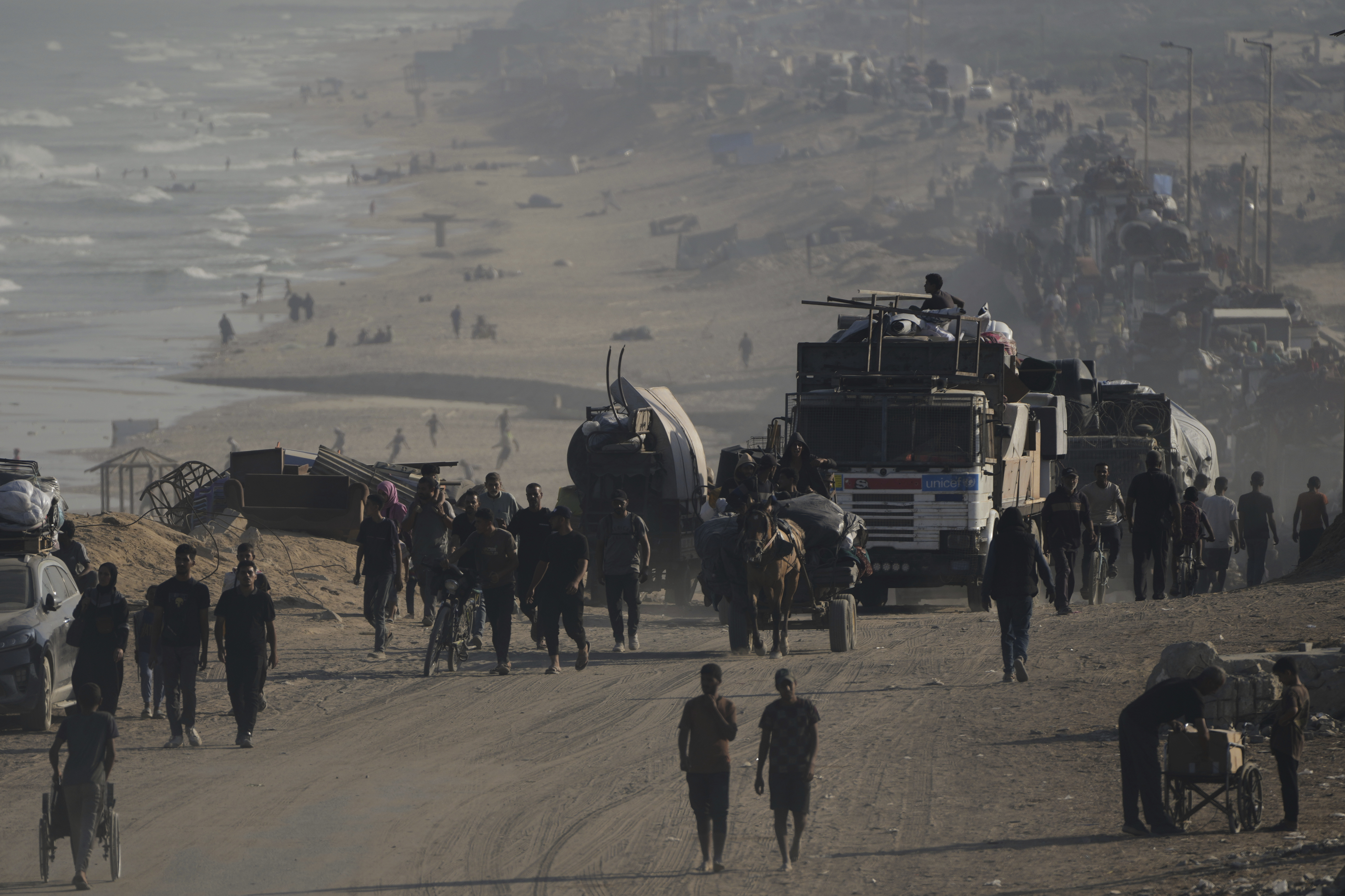 Displaced Palestinians flee Gaza City by foot and vehicles, carrying their belongings along the coastal road toward southern Gaza, Wednesday, Sept. 17, 2025. (Abdel Kareem Hana - AP)