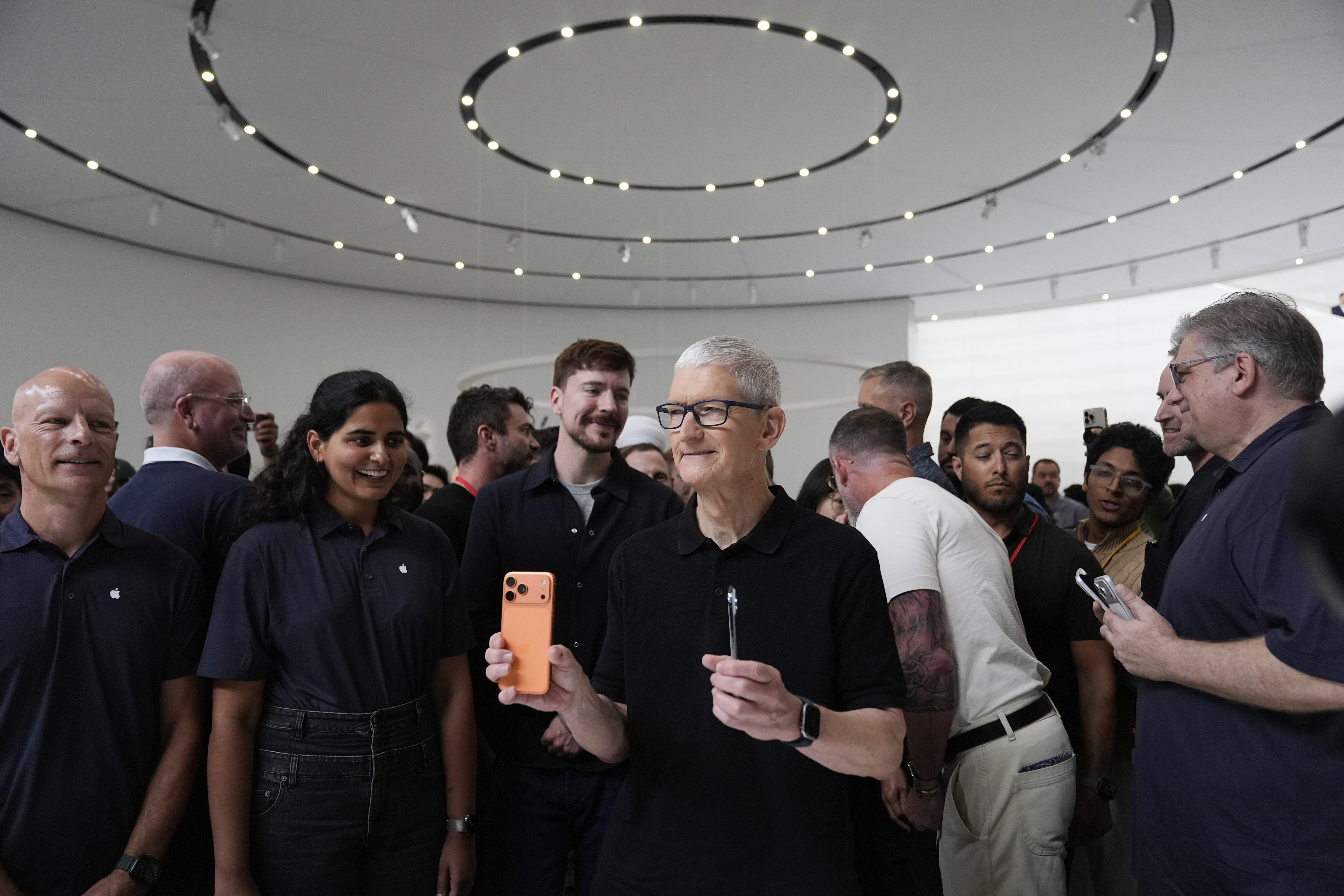 Apple CEO Tim Cook holds new iPhones during an announcement of new products at Apple Park on Tuesday, Sept. 9, 2025, in Cupertino, Calif. (Godofredo A. Vásquez - AP)