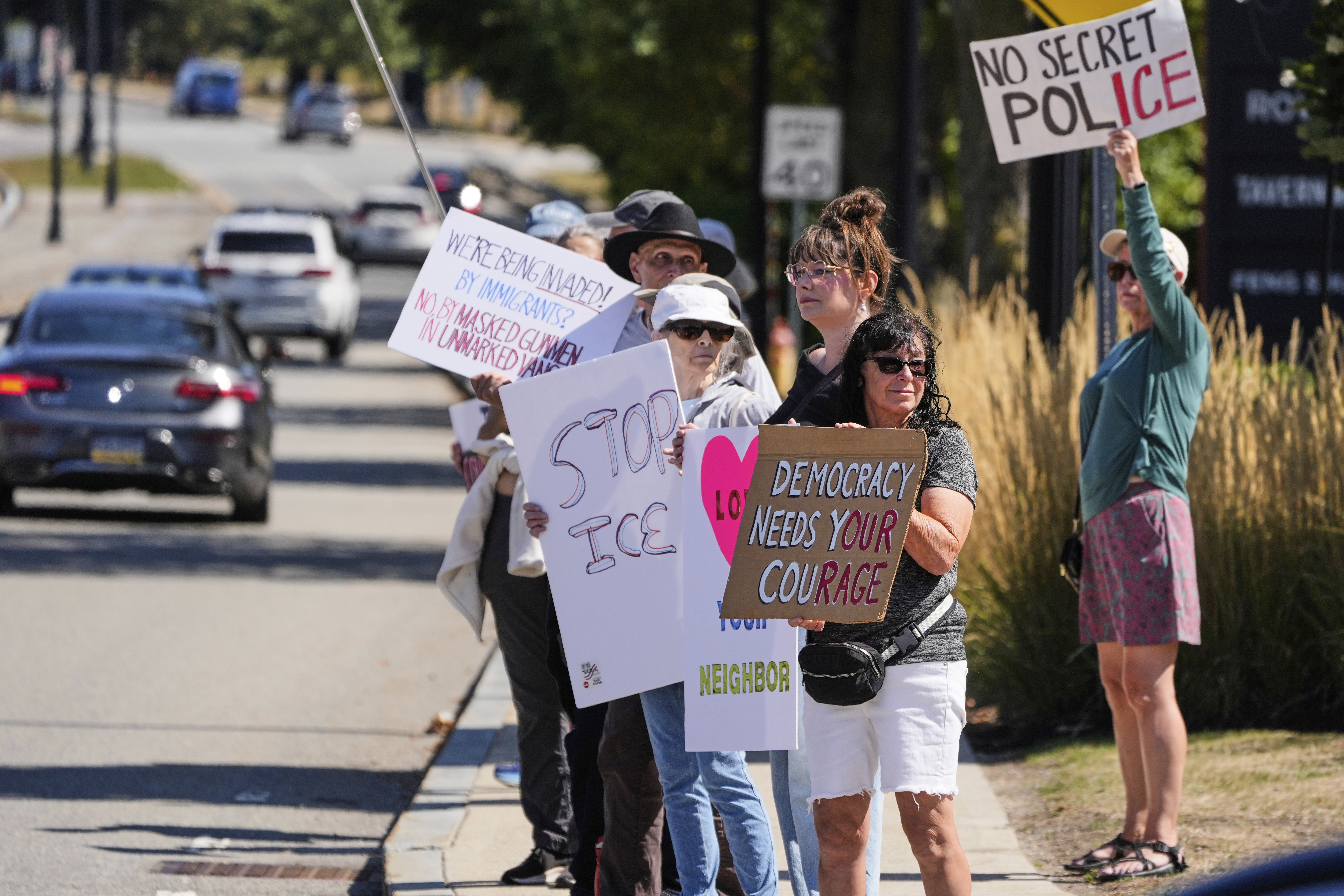 Protesters picket near the U.S. Immigration and Customs Enforcement regional field office, Thursday, Sept. 11, 2025, in Burlington, Mass. (Charles Krupa - AP)