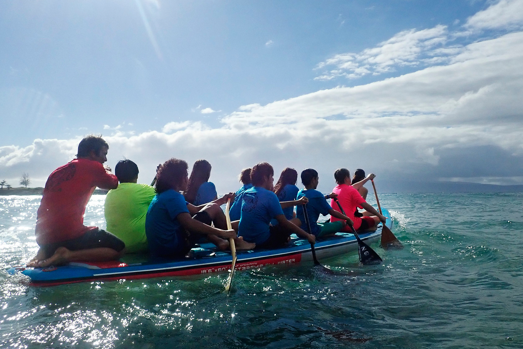Kahākūahi Ocean Academy's Zane Kekoa Schweizer, left, steers as Maui Hero Project youth paddle into the bay from D.T. Fleming Beach in Lahaina, Hawaii, on Tuesday, June 10, 2025. (Kevin Fujii - Honolulu Civil Beat)