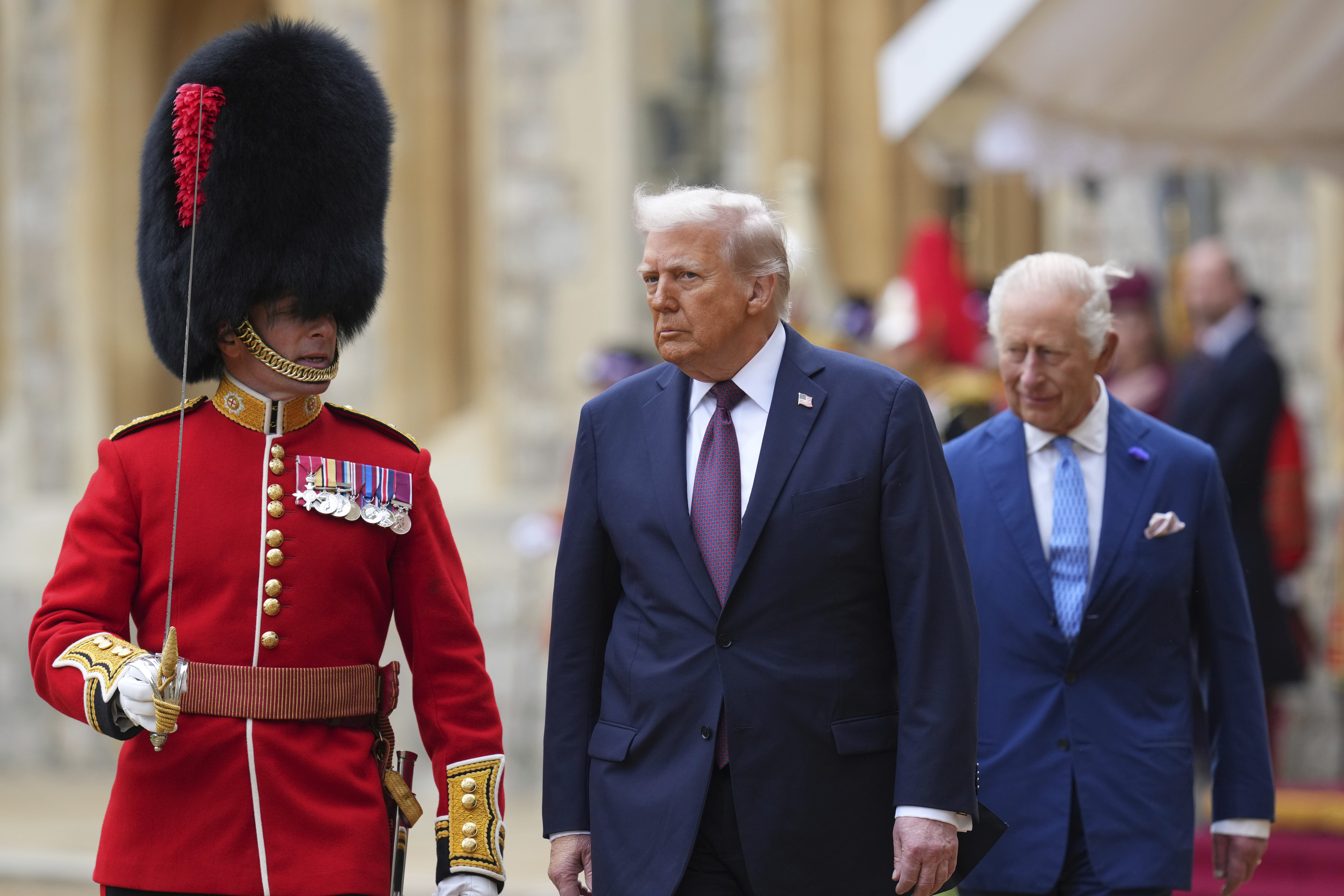 President Donald Trump and Britain's King Charles III review the Guard of Honour after the arrival at Windsor Castle in Windsor, England, Wednesday, Sept. 17, 2025. (Kirsty Wigglesworth - Pool AP)