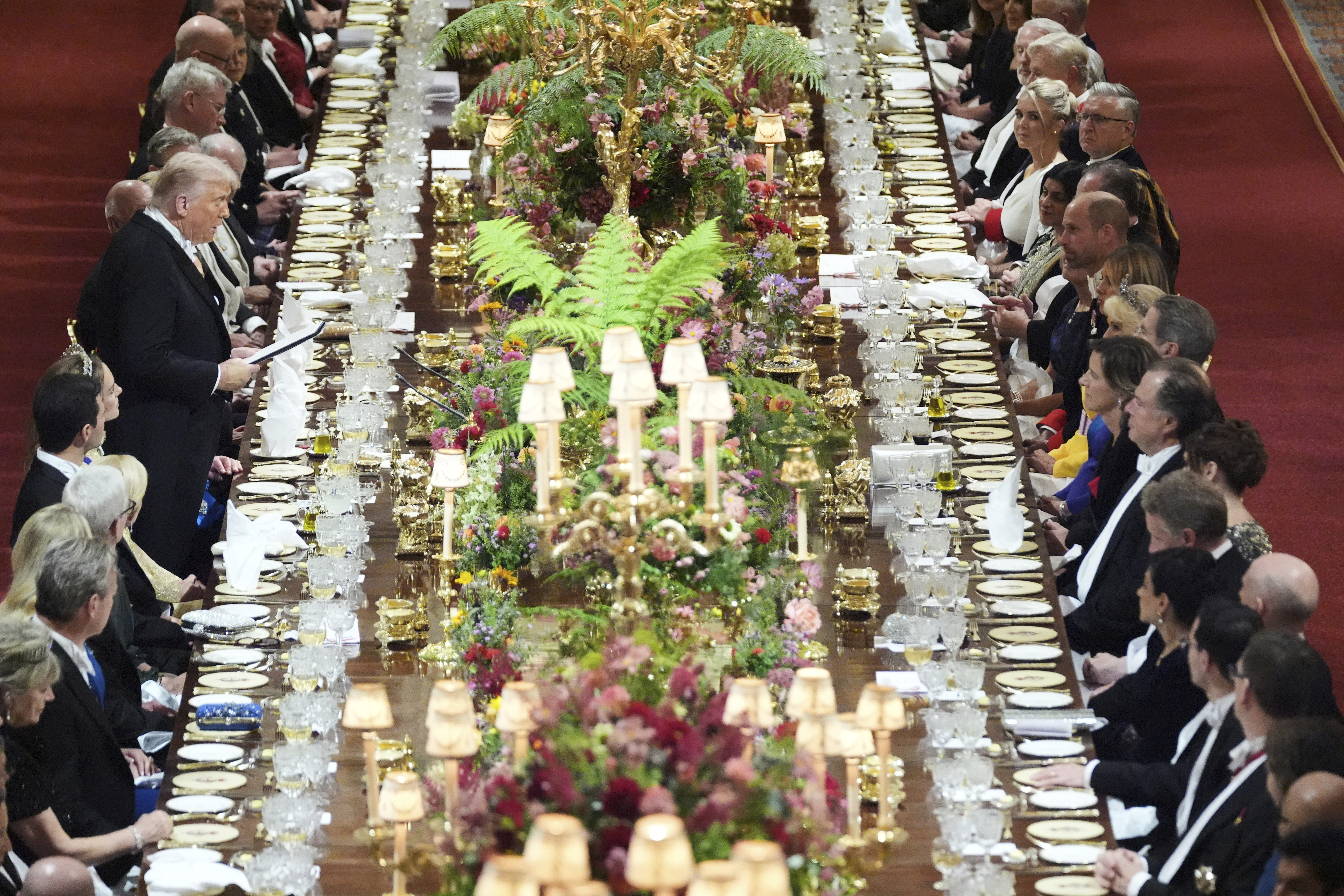 President Donald Trump, center left, speaks during a State Banquet at Windsor Castle in Windsor, England, Wednesday, Sept. 17, 2025. (Evan Vucci - Pool AP)