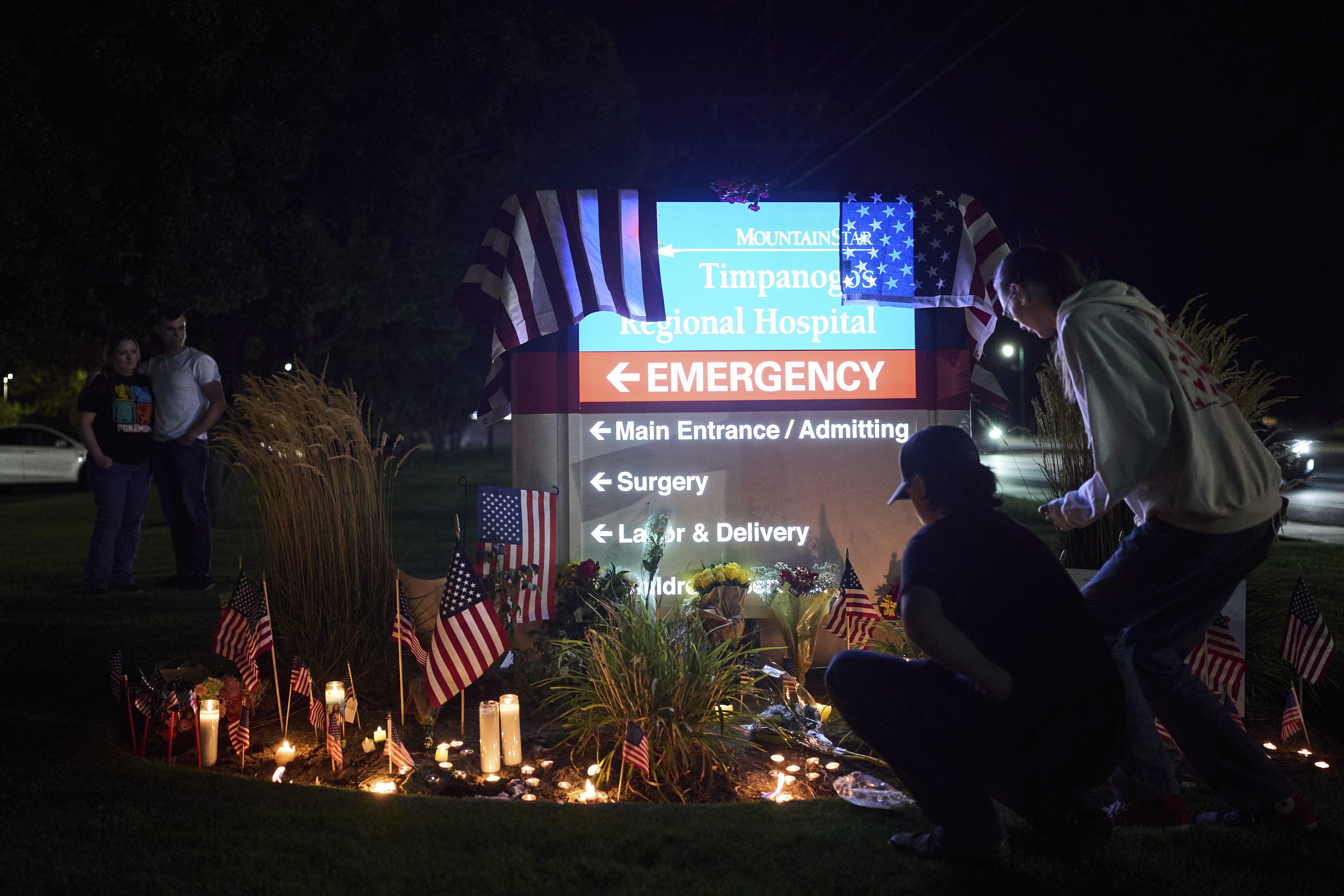 People visit a growing vigil for Charlie Kirk outside Timpanogos Regional Hospital after Kirk was shot and killed Wednesday, Sept. 10, 2025, in Orem, Utah. (Lindsey Wasson - AP)