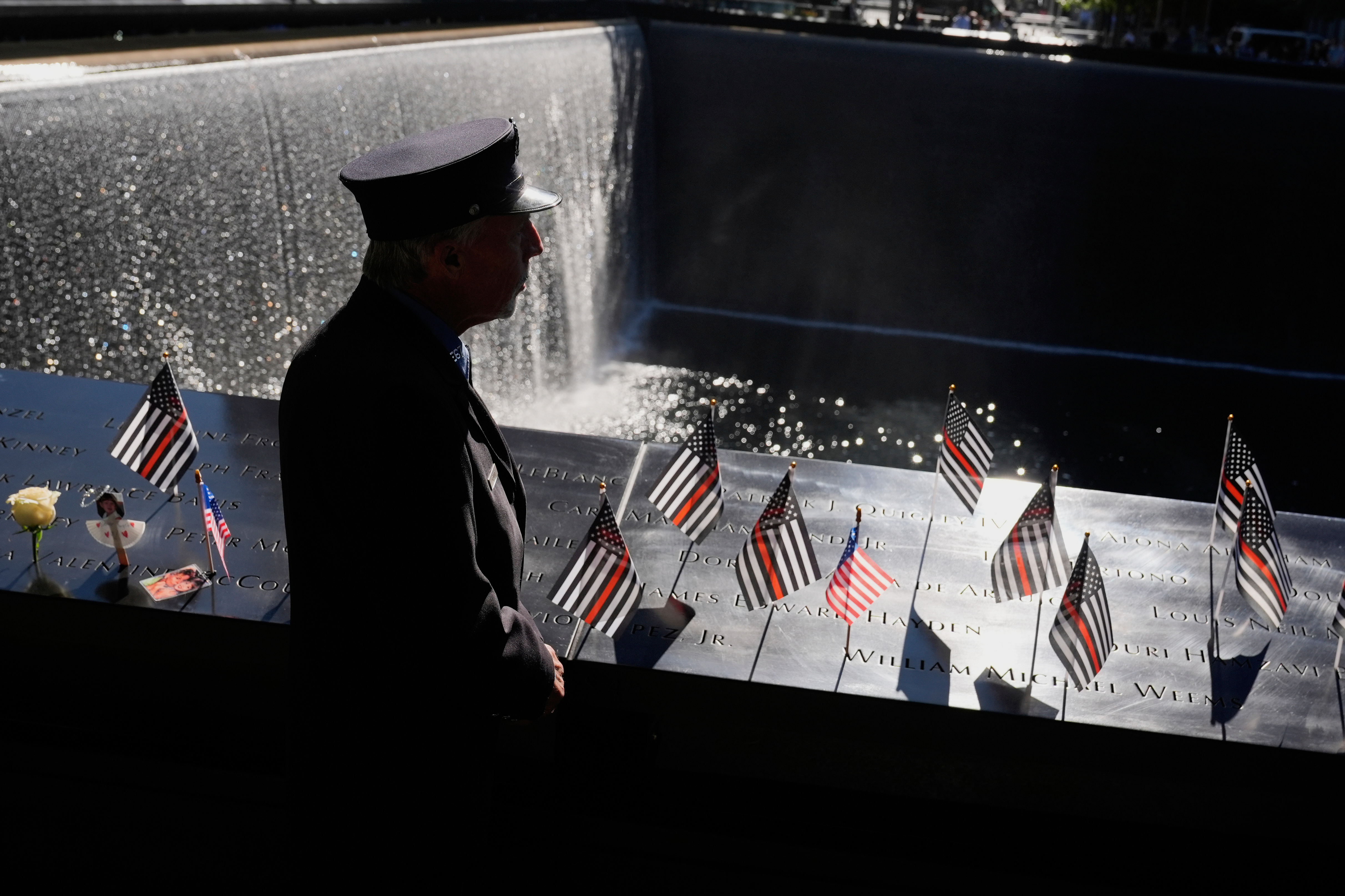 William Staudt, a firefighter that worked at Ground Zero on the day of the attacks, looks over a reflecting pool during a ceremony to mark the 24th anniversary of the 9/11 attacks, Thursday, Sept. 11, 2025, in New York. (Seth Wenig - AP)
