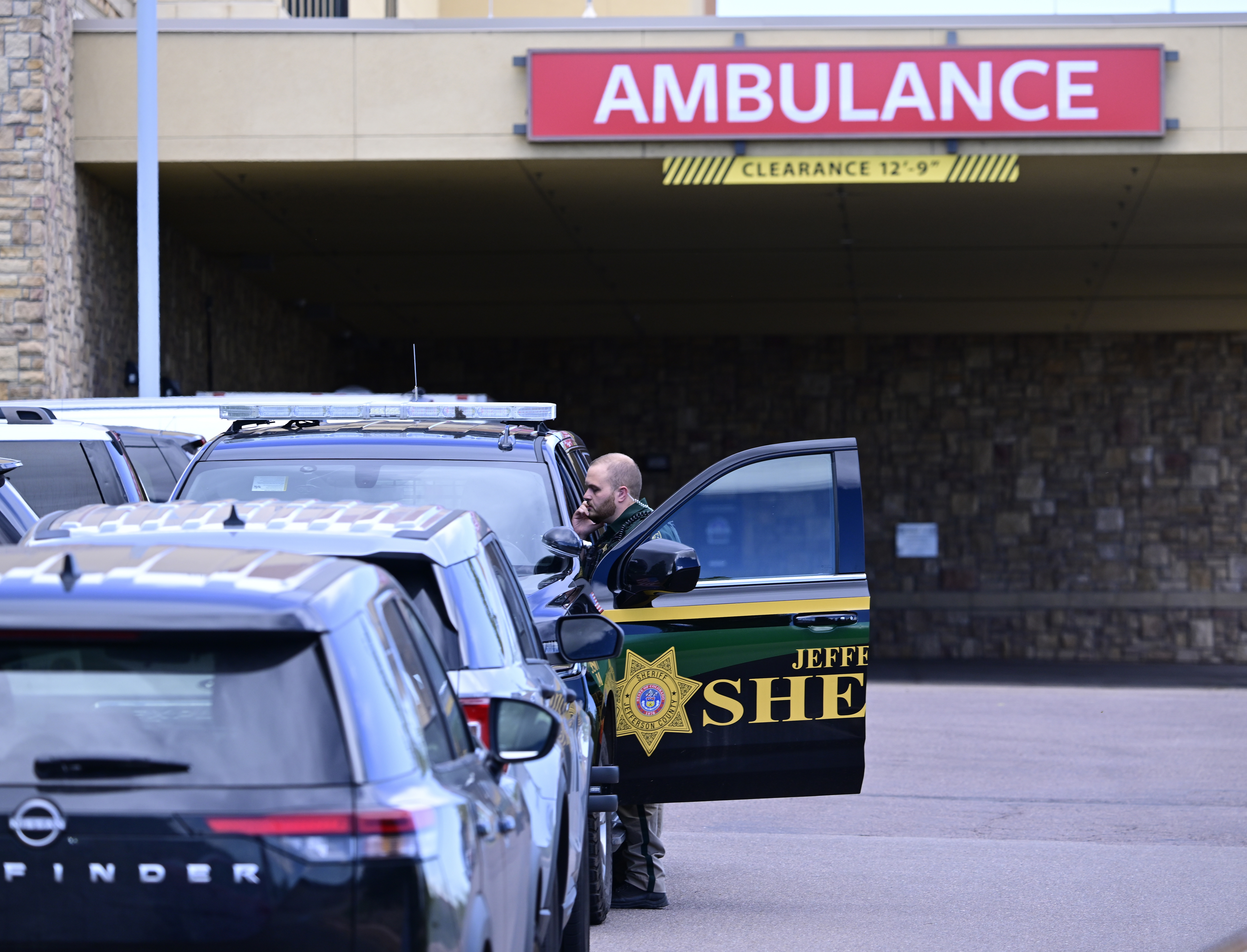 A Jefferson County, Colo., Sheriffs Department deputy is stationed outside of the St. Anthony's Hospital emergency entrance in Lakewood, Colo., on Wednesday, Sept. 10, 2025. (Andy Cross - The Denver Post)