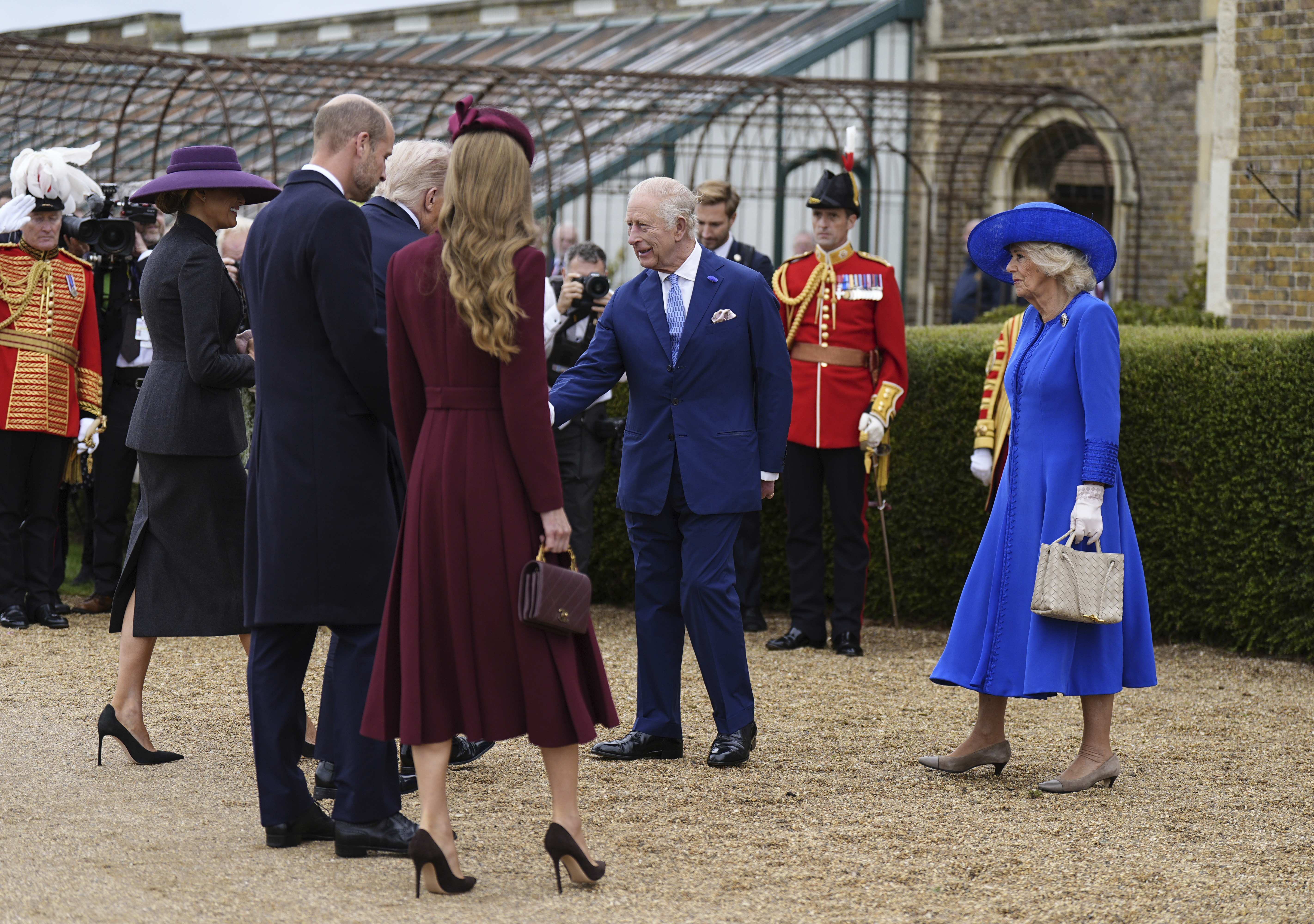 Britain's King Charles III and Queen Camilla, right, receive President Donald Trump and first lady Melania Trump as Prince William and Kate, Princess of Wales look on, as they arrive at Windsor Castle in Windsor, England, Wednesday Sept. 17, 2025. (Aaron Chown - Pool PA)
