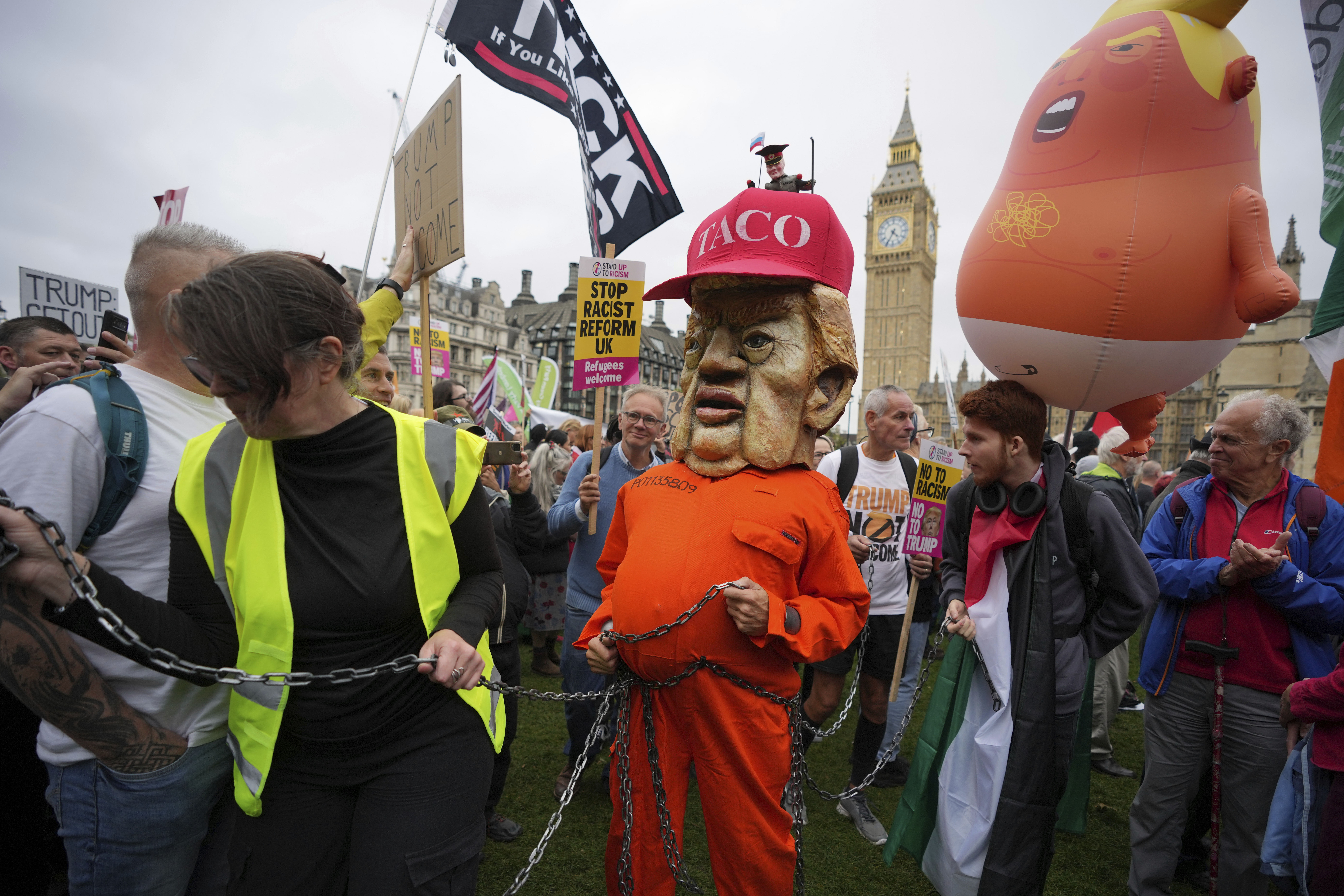 A protester wears a jail costume with a Trump mask during a demonstration of the Stop Trump Coalition group against President Donald Trump's state visit in London, Wednesday, Sept. 17, 2025. (Kin Cheung - AP)
