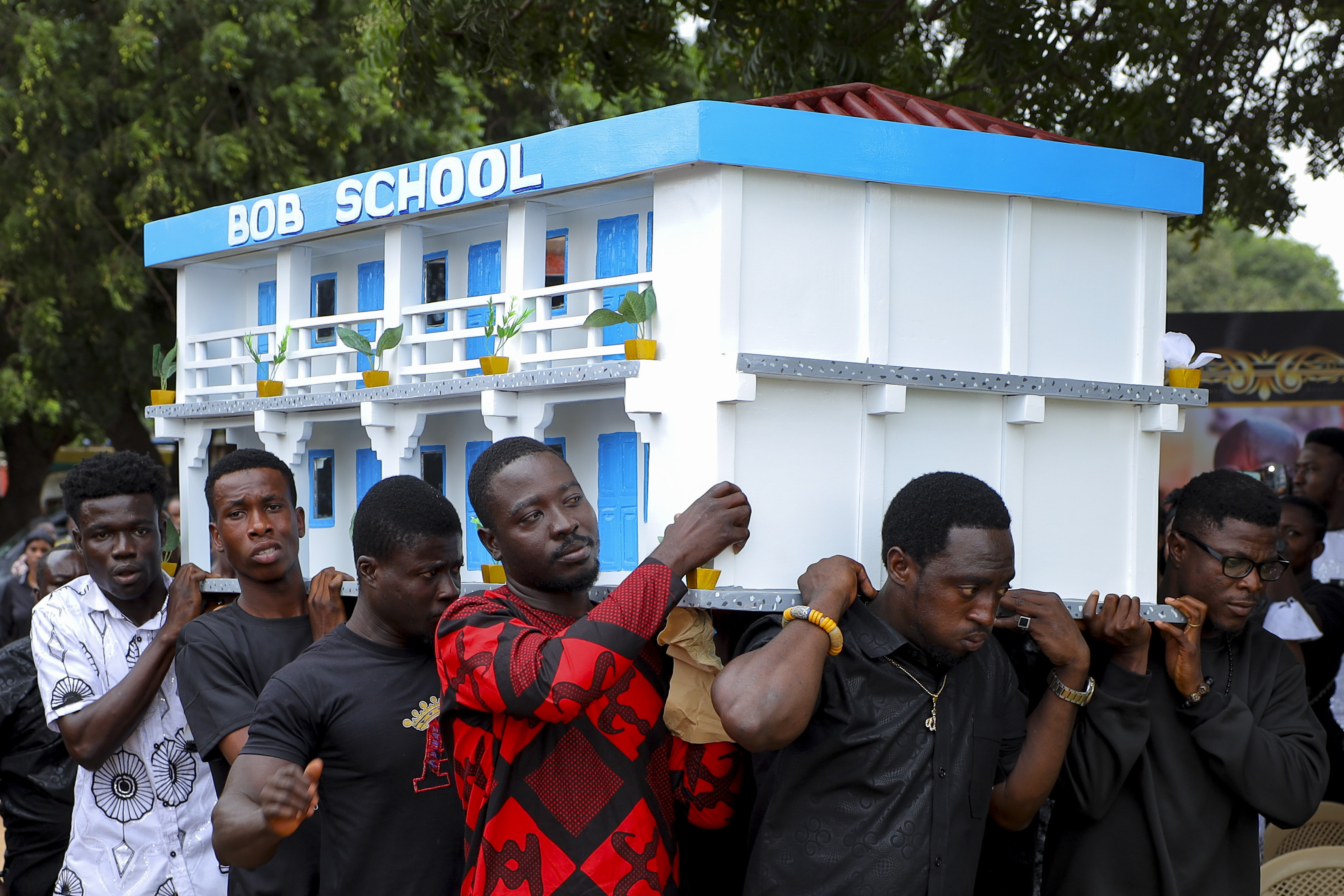 Men carry the fantasy coffin of the late Robert Nii Anang Obodai, a former school proprietor, during his funeral, in Accra, Ghana, Saturday, July 26, 2025. (Misper Apawu - AP)