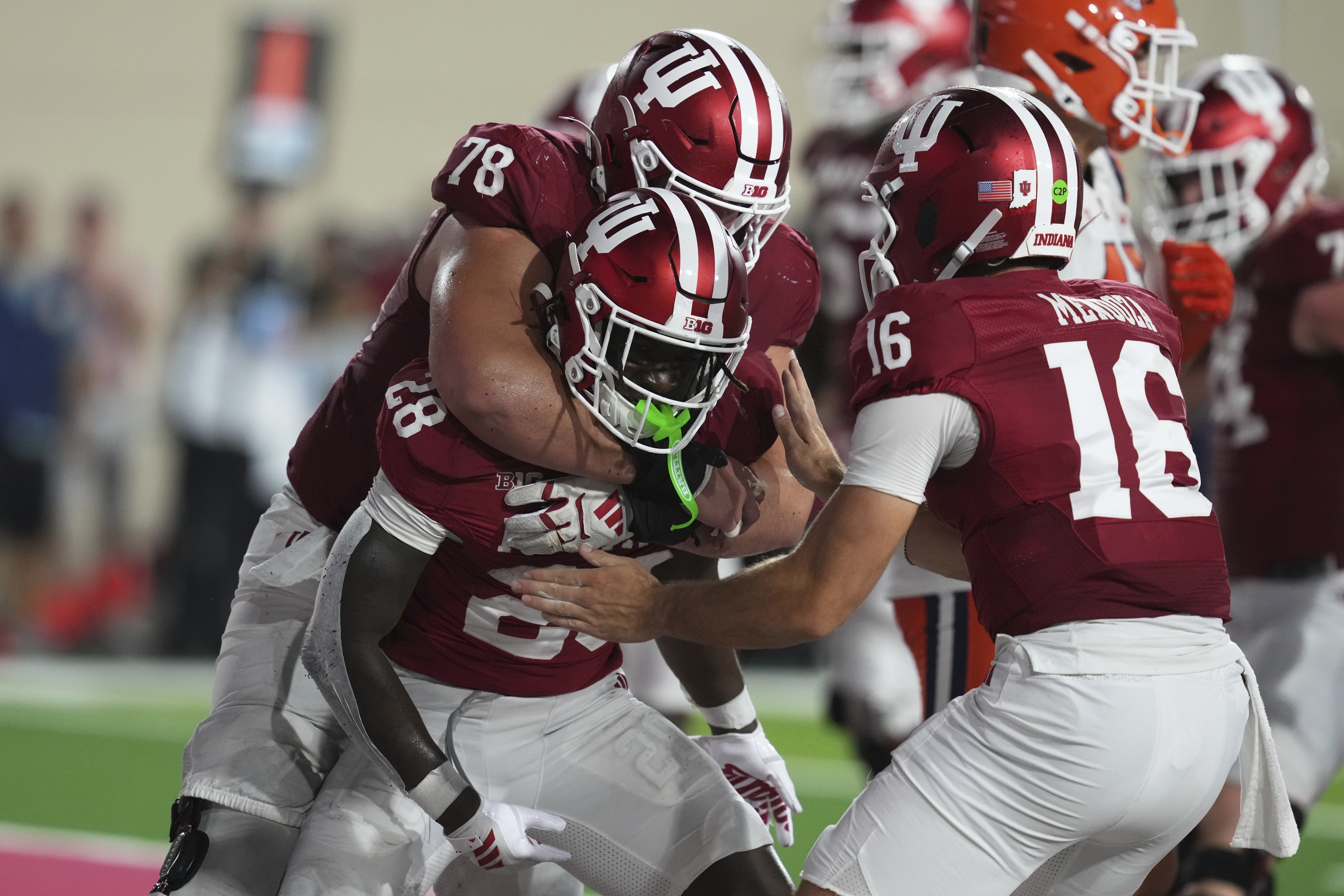 Indiana running back Khobie Martin (28) celebrates a touchdown run with offensive lineman Pat Coogan (78) and quarterback Alberto Mendoza during the second half of an NCAA college football game, Saturday, Sept. 20, 2025, in Bloomington, Ind. (Darron Cummings - AP)
