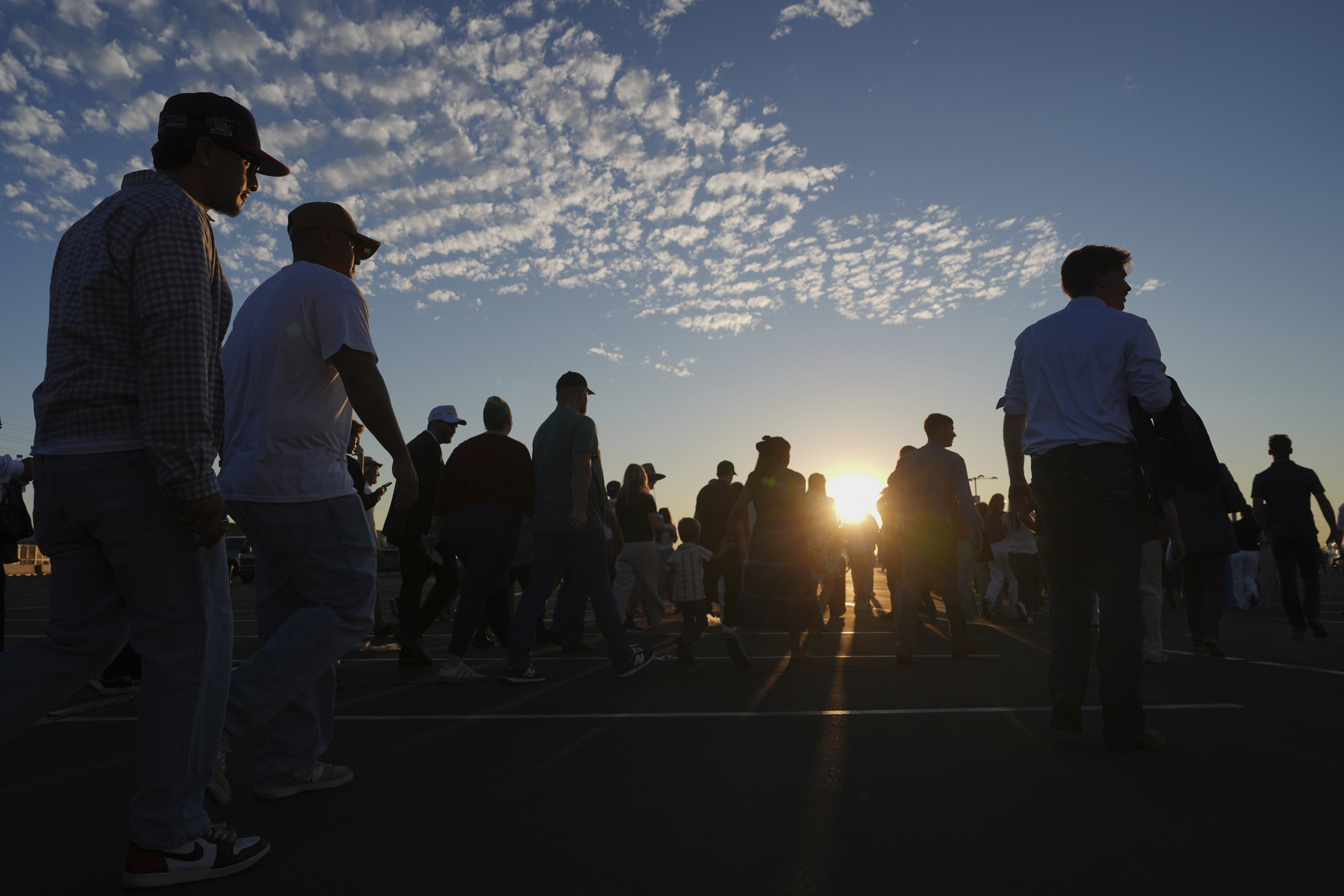 People wait in line before a memorial for conservative activist Charlie Kirk Sunday, Sept. 21, 2025, at State Farm Stadium in Glendale, Ariz. (Jae C. Hong - AP)