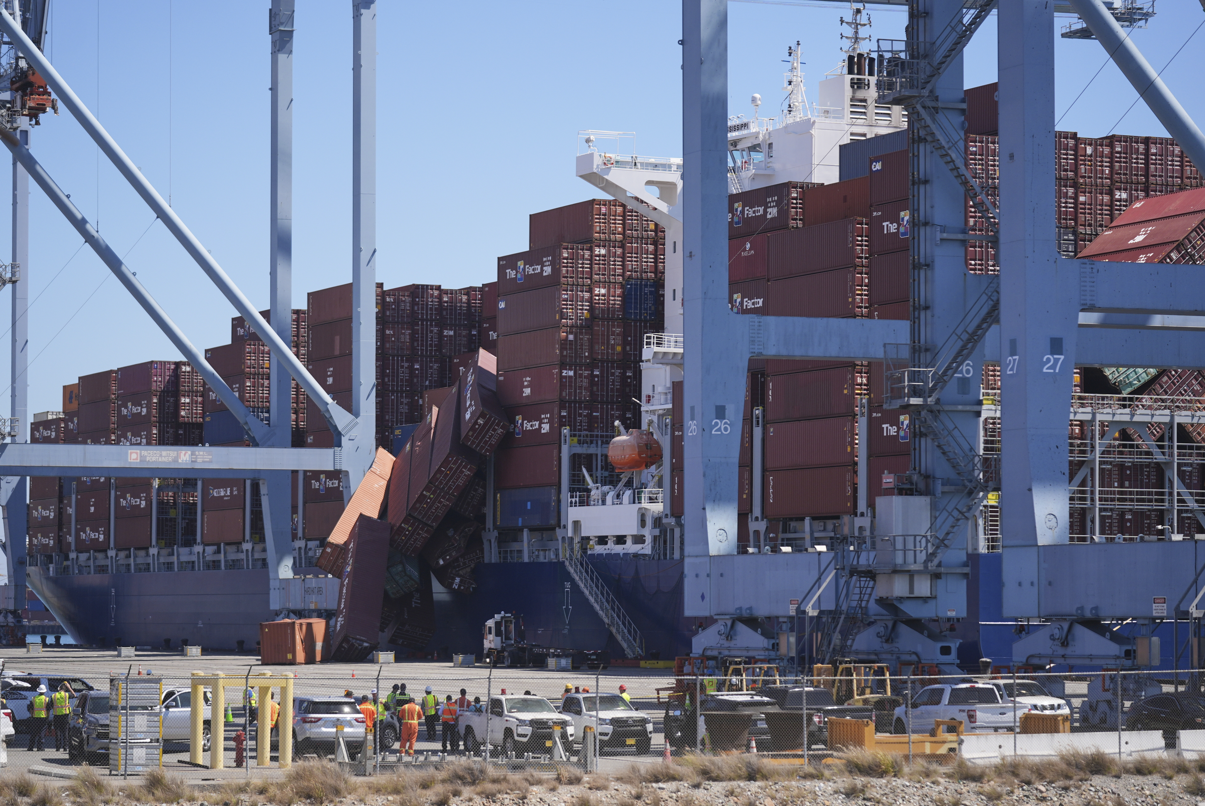 Containers topple off a cargo ship at the Port of Long Beach on Tuesday, Sept. 9, 2025, in Long Beach, Calif. (Damian Dovarganes - AP)