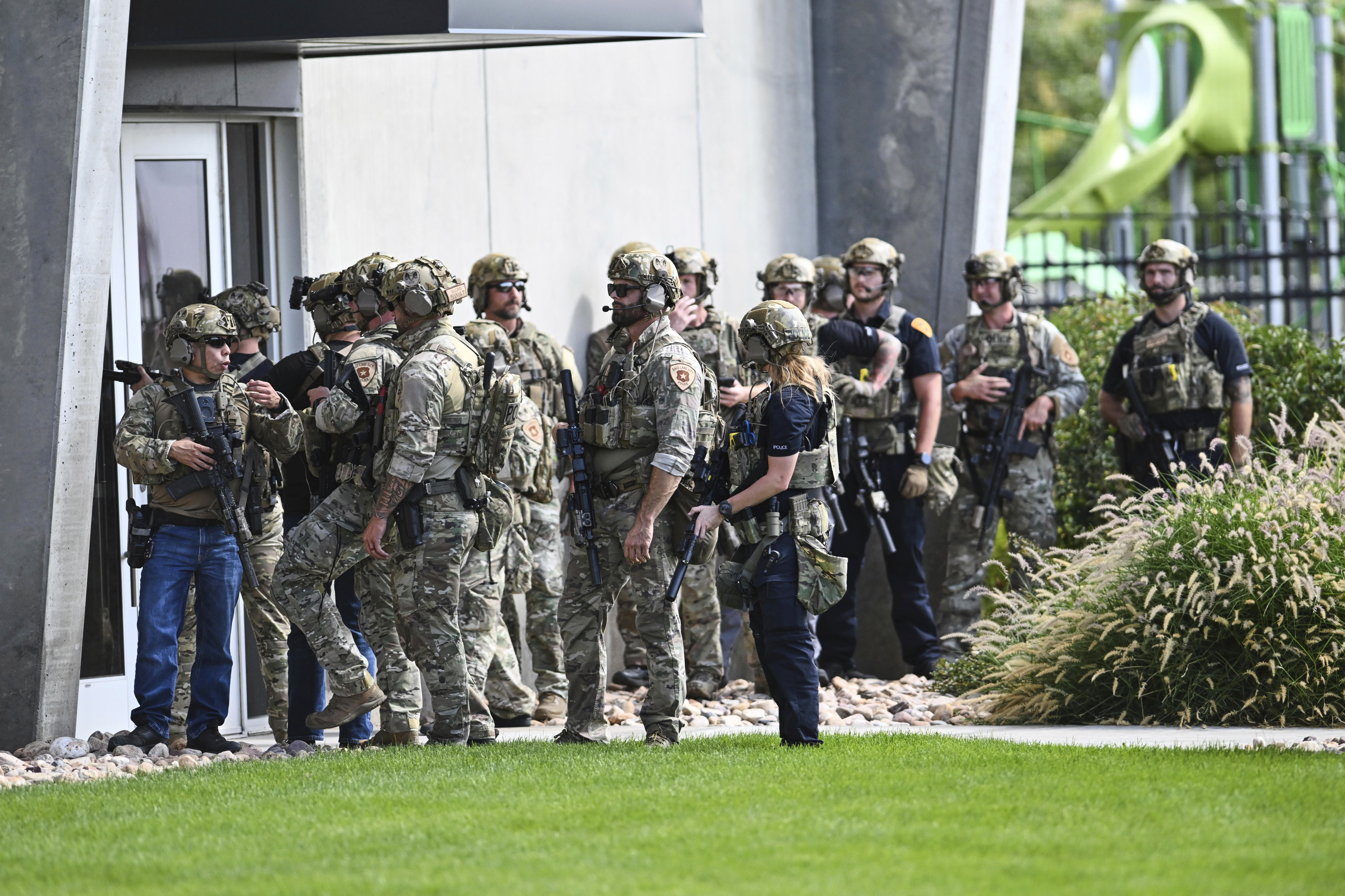 Law enforcement officials prepare to sweep a building at Utah Valley University, Wednesday, Sept. 10, 2025, in Orem, Utah. (Tyler Tate - FR171662 AP)