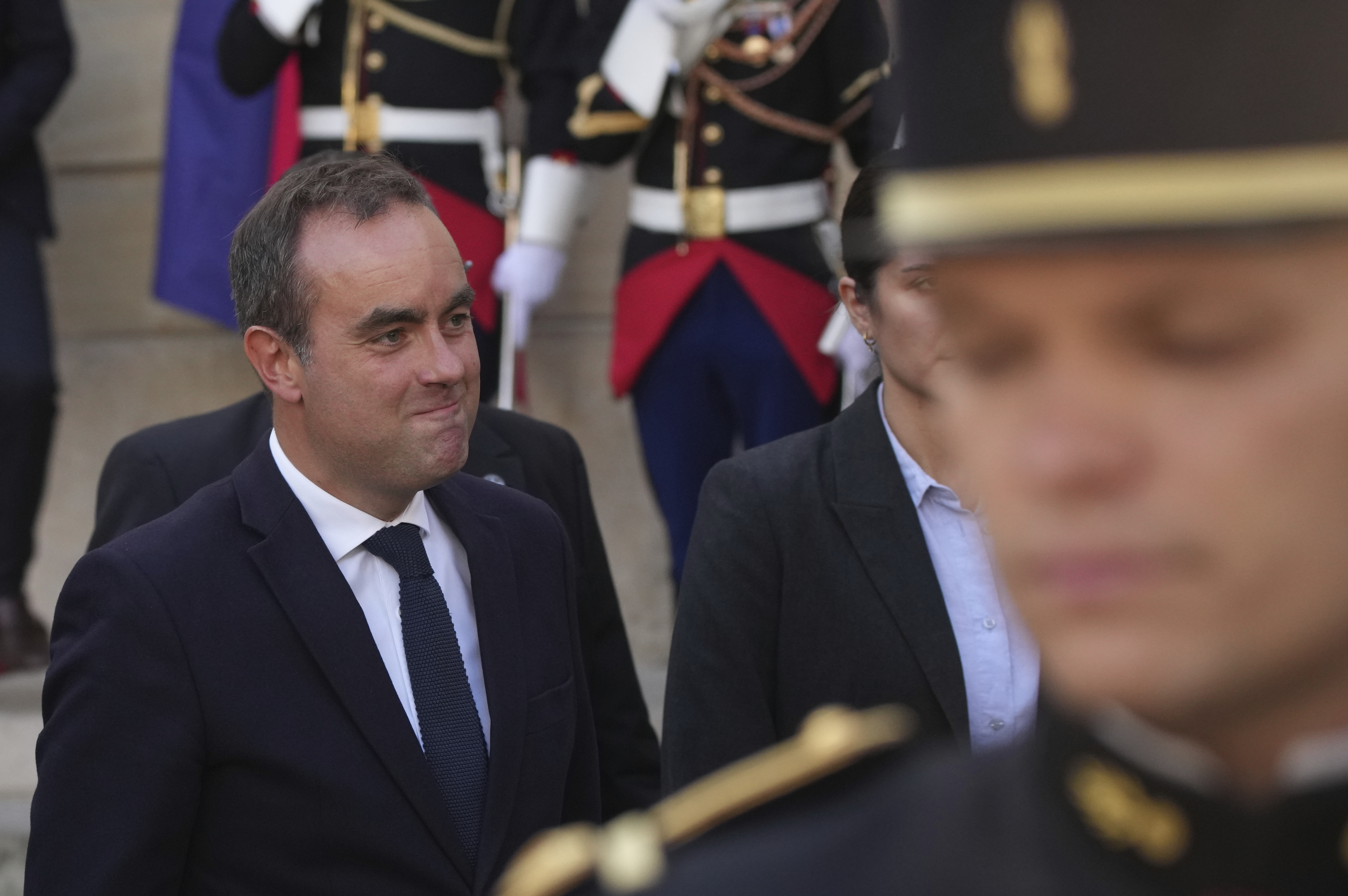 Strikes and protests roil France, pitting the streets against Macron and his new prime minister