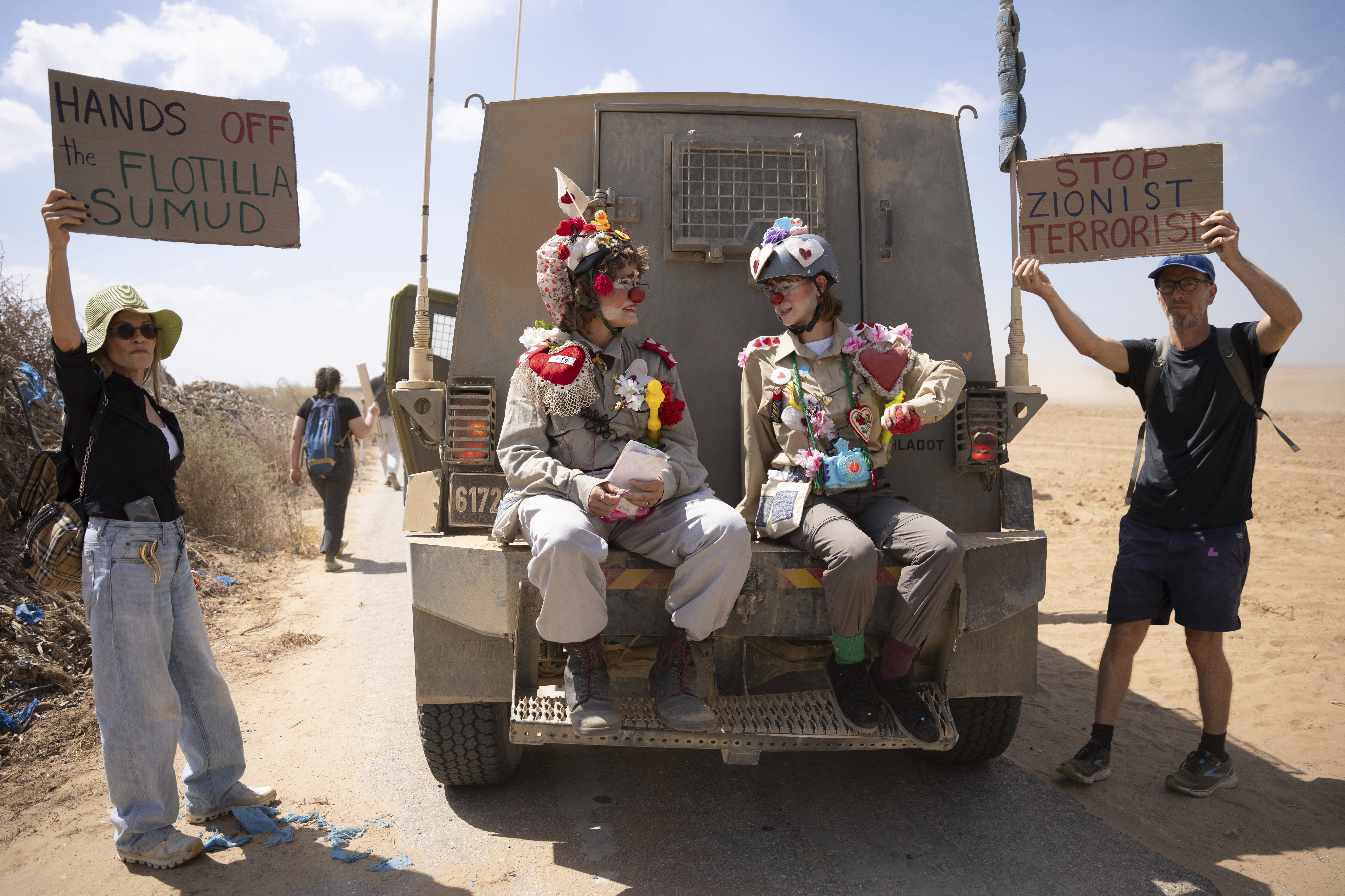 Activists take part in a protest against the war in the Gaza Strip, as they stand in an area at the Israeli-Gaza border in southern Israel, Friday, Sept. 19, 2025. (Maya Levin - AP)