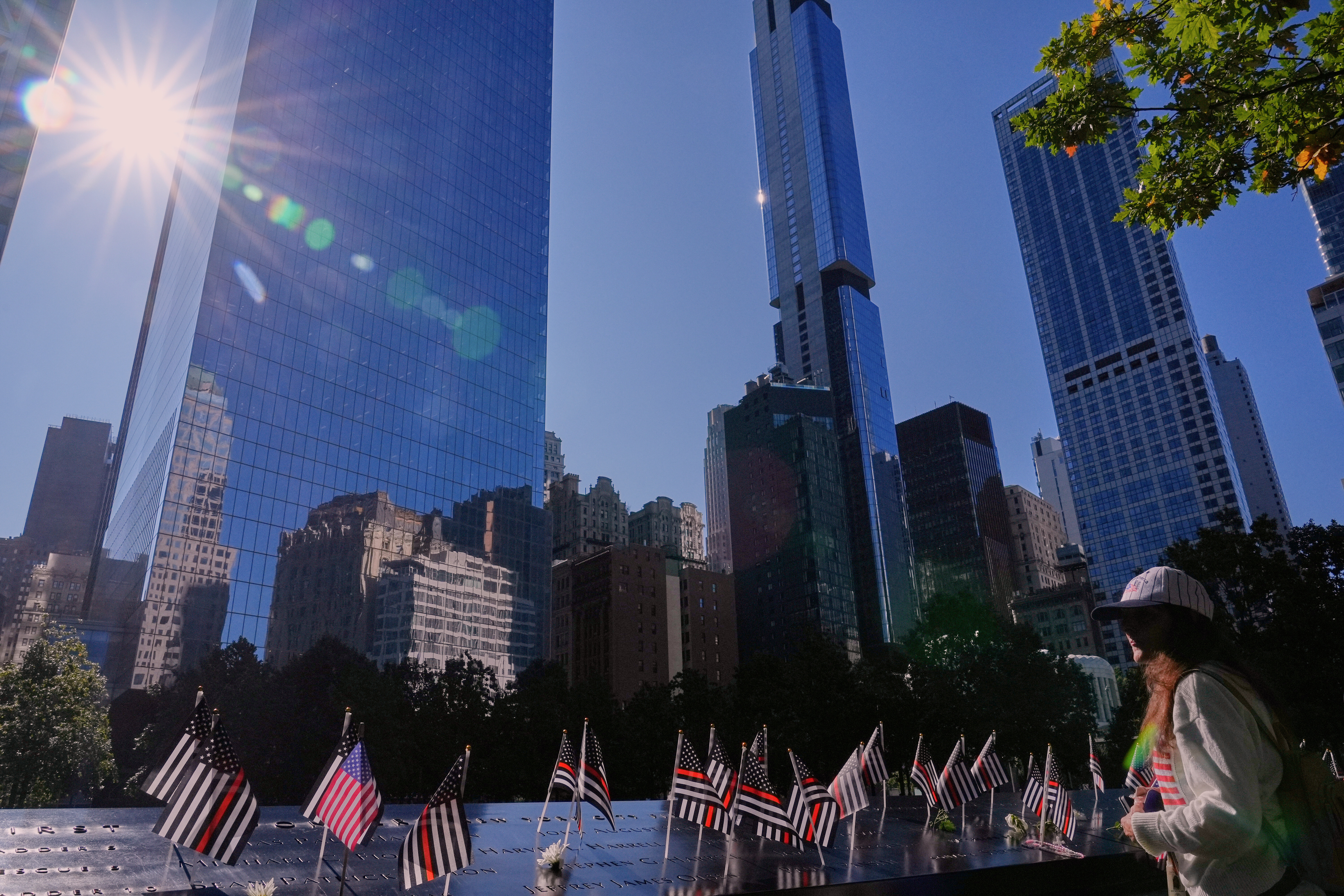 Mary Beth Delarm looks over the the names on the the 9/11 Memorial during a ceremony to mark the 24th anniversary of the 9/11 attacks, Thursday, Sept. 11, 2025, in New York. (Seth Wenig - AP)