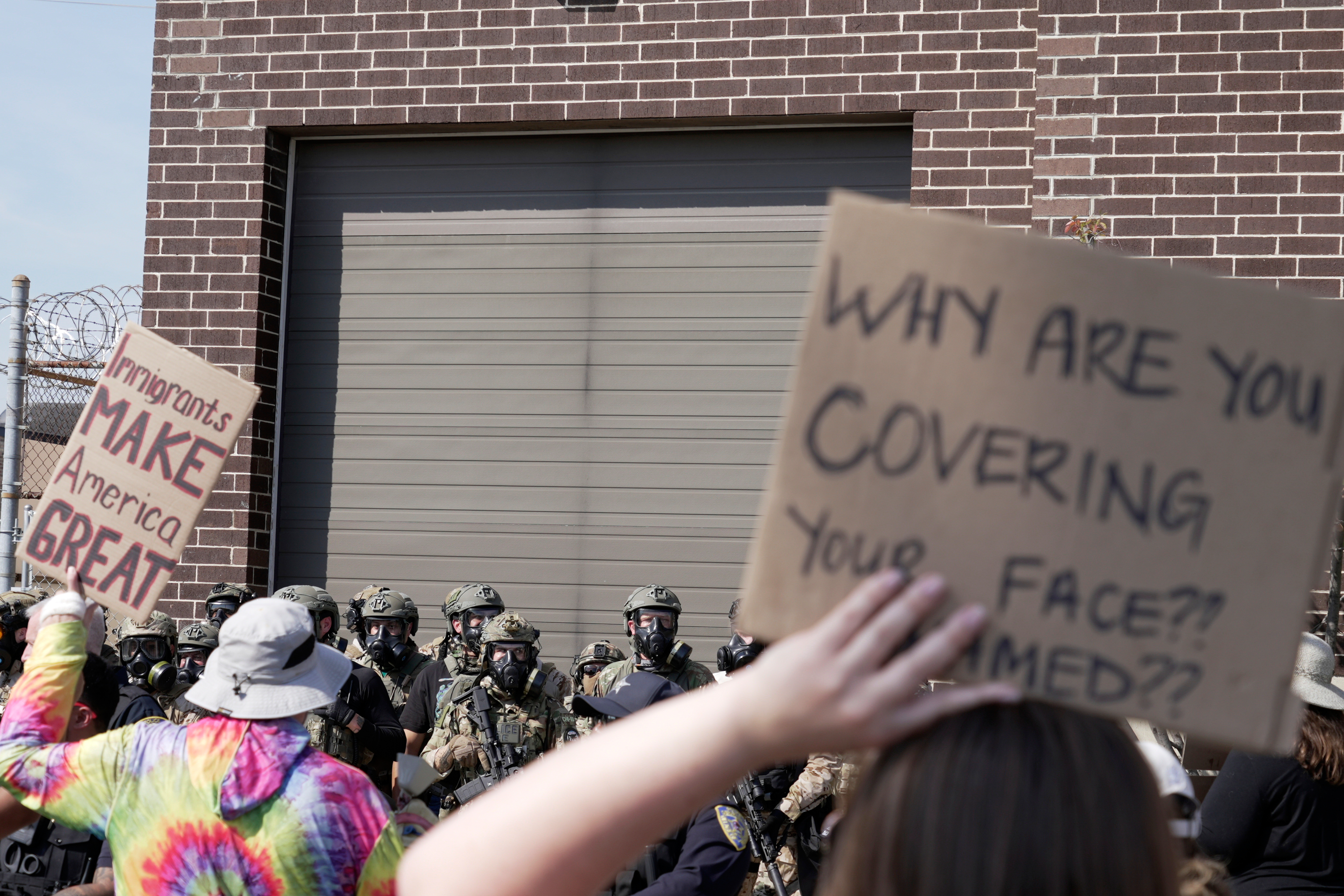 People protest outside of an immigration facility guarded by federal agents Friday, Sept. 12, 2025, in in Broadview, Ill. (Laura Bargfeld - AP)