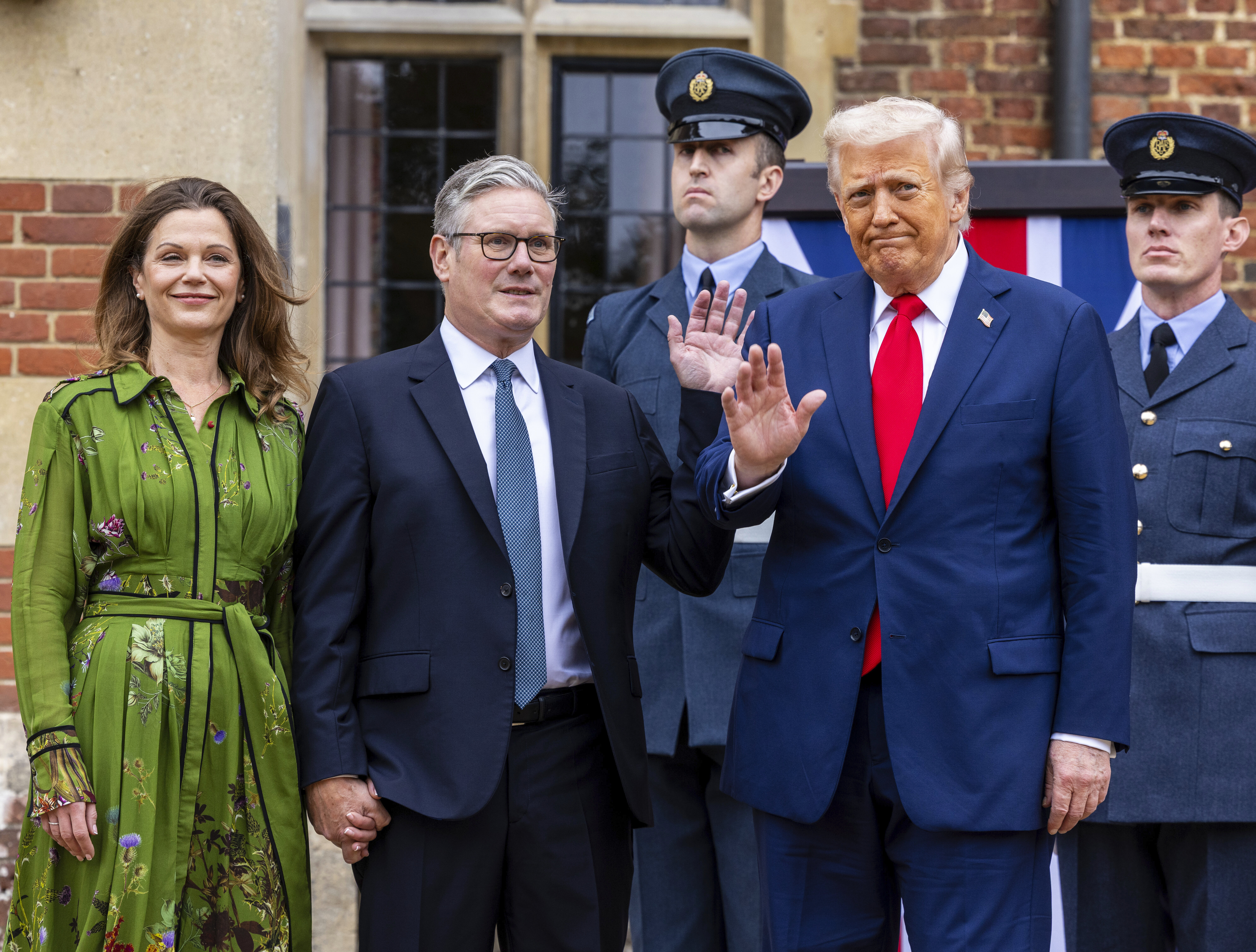 President Donald Trump, foreground right is greeted by Britain's Prime Minister Keir Starmer and his wife Victoria, as he visits the prime minister's country residence Chequers, near Aylesbury, England, Thursday, Sept. 18, 2025. (Ian Vogler - Pool Daily Mirror)