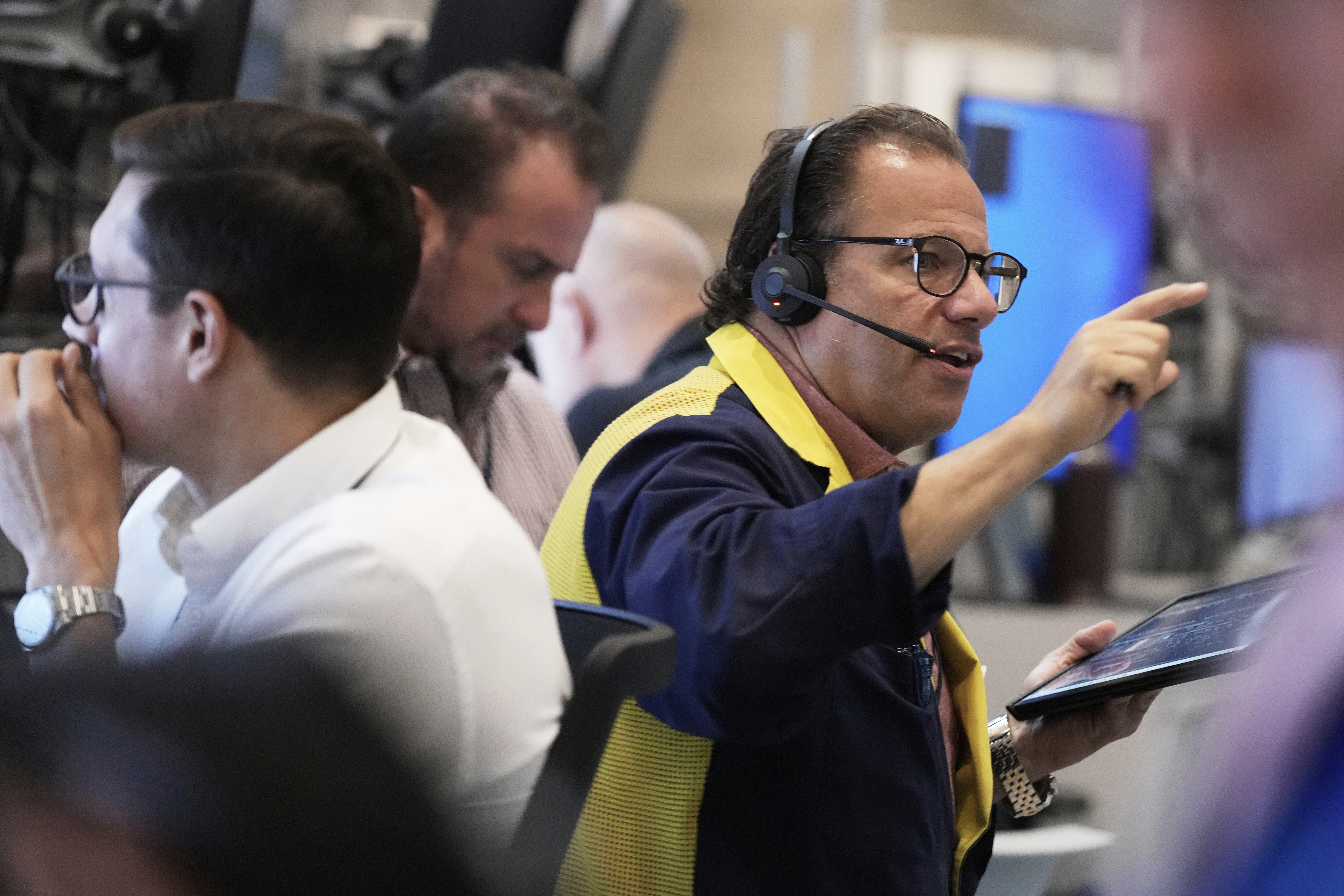 Options trader Anthony Spina, right, works on the floor of the New York Stock Exchange, Monday, Sept. 15, 2025. (Richard Drew - AP)