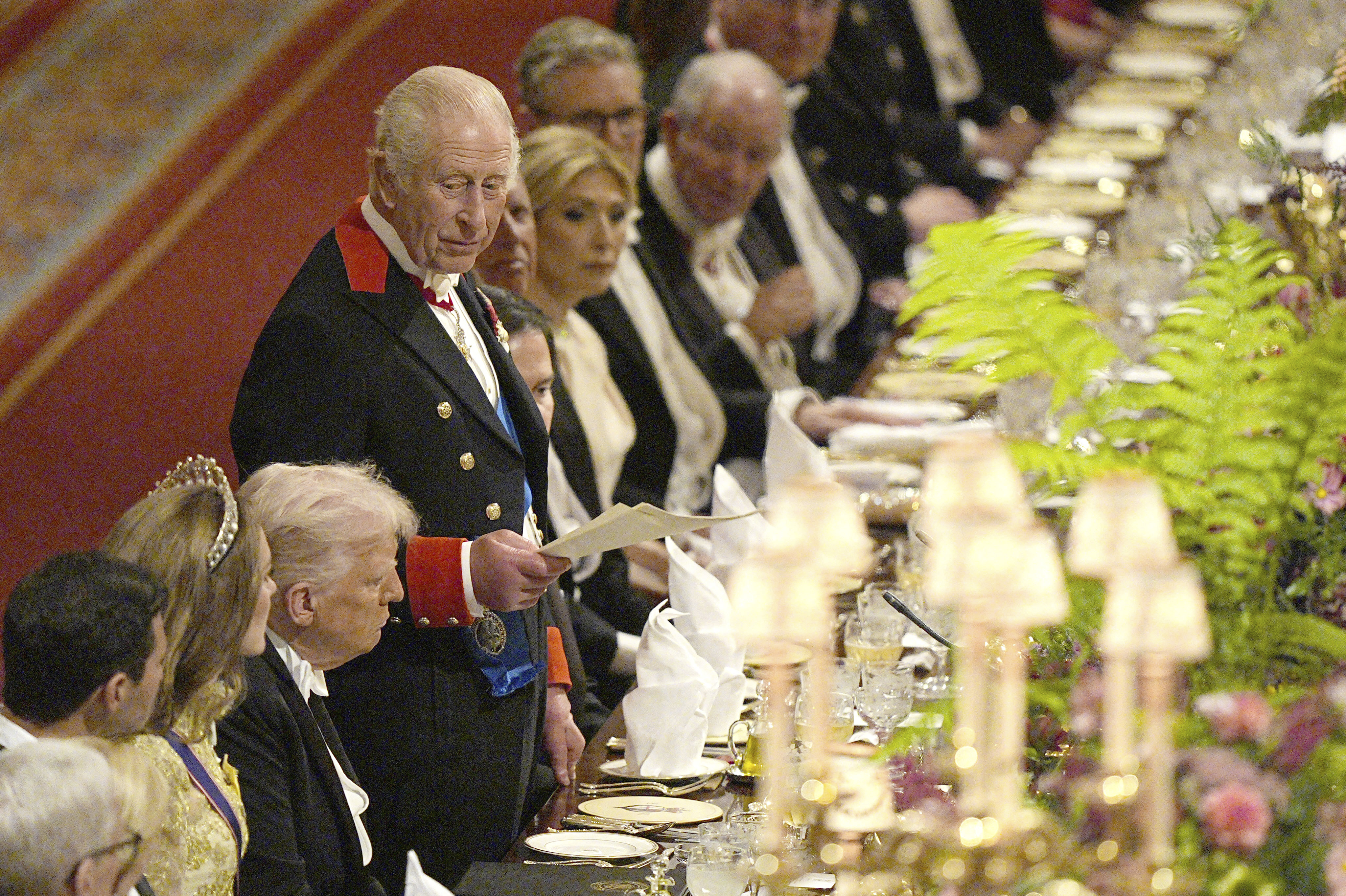 U.S. President Donald Trump, fourth left, listens as Britain's King Charles gives a speech during the State Banquet in Windsor Castle, England, on day one of U.S. President Donald Trump and First Lady Melania Trump's second state visit to the UK, Wednesday Sept. 17, 2025. (Aaron Chown - Pool PA)