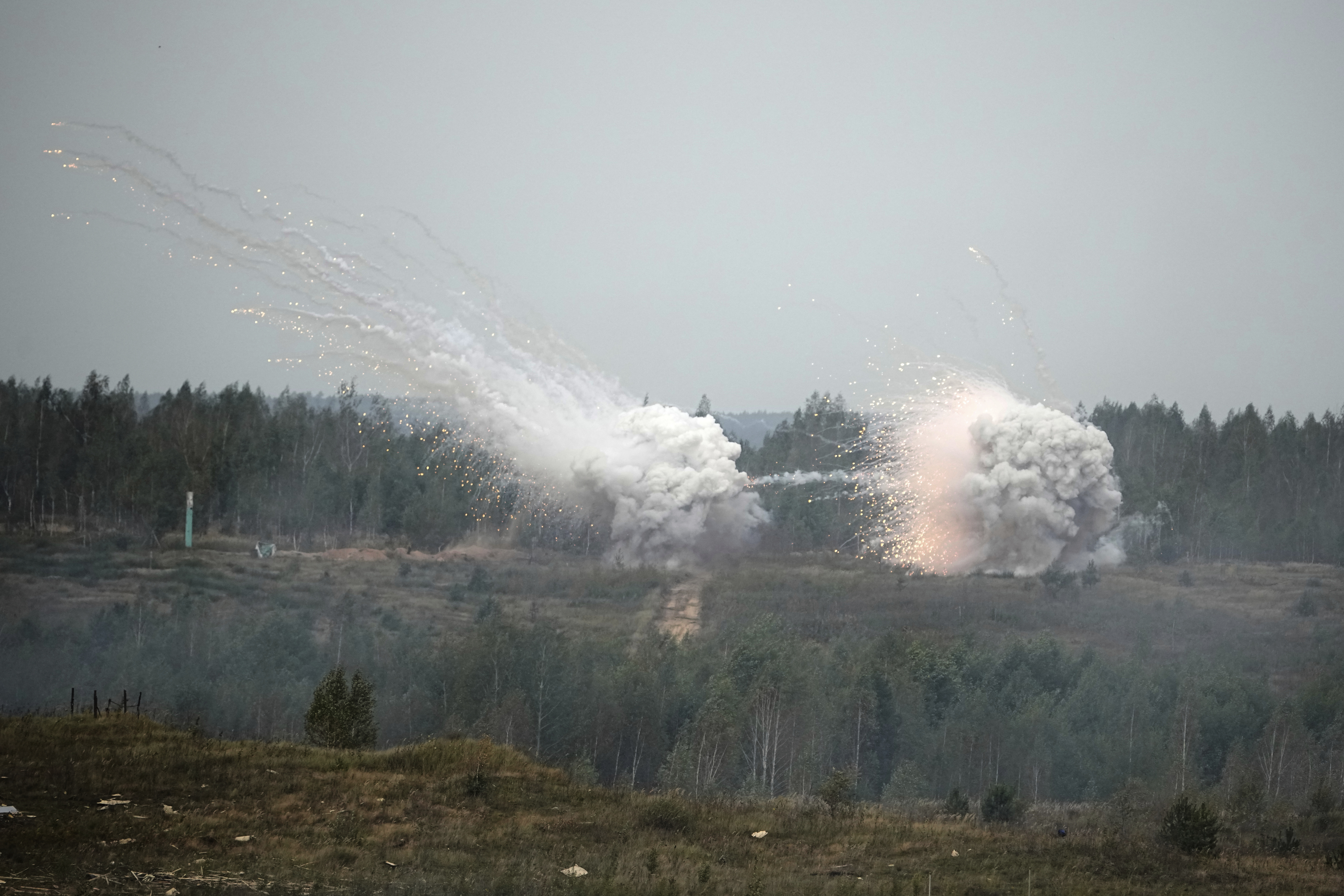 Explosions are seen during joint Russian-Belarusian military drills at a training ground near Barysaw, Belarus, Monday, Sept. 15, 2025. (Pavel Bednyakov - AP)