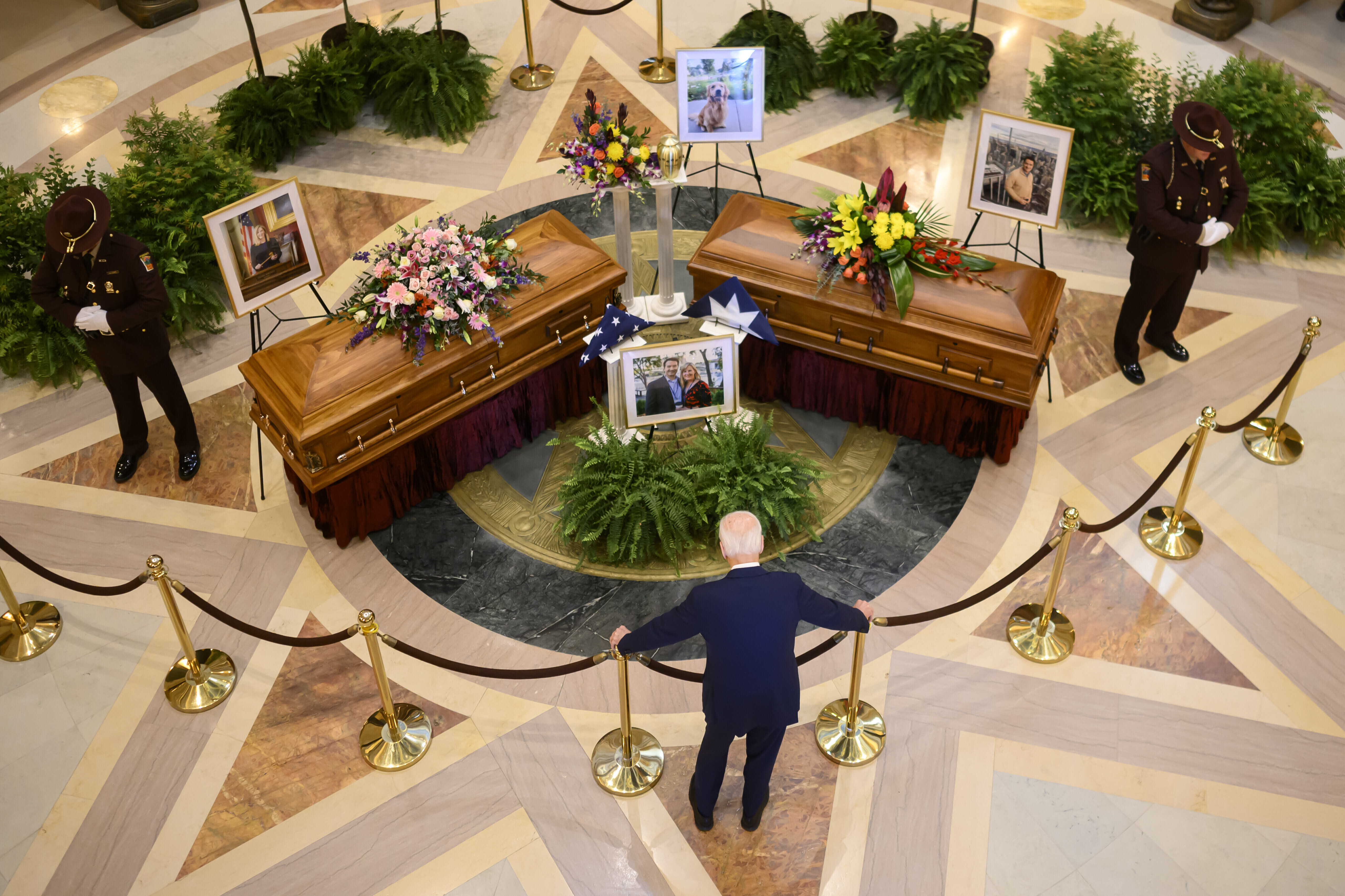 FILE - Former President Joe Biden pays his final respects to former Minnesota House Speaker Melissa Hortman, her husband, Mark, and their golden retriever, Gilbert, while they lie in state in the Minnesota Capitol rotunda in St. Paul, Friday, June 27, 2025. (Alex Kormann - Star Tribune)