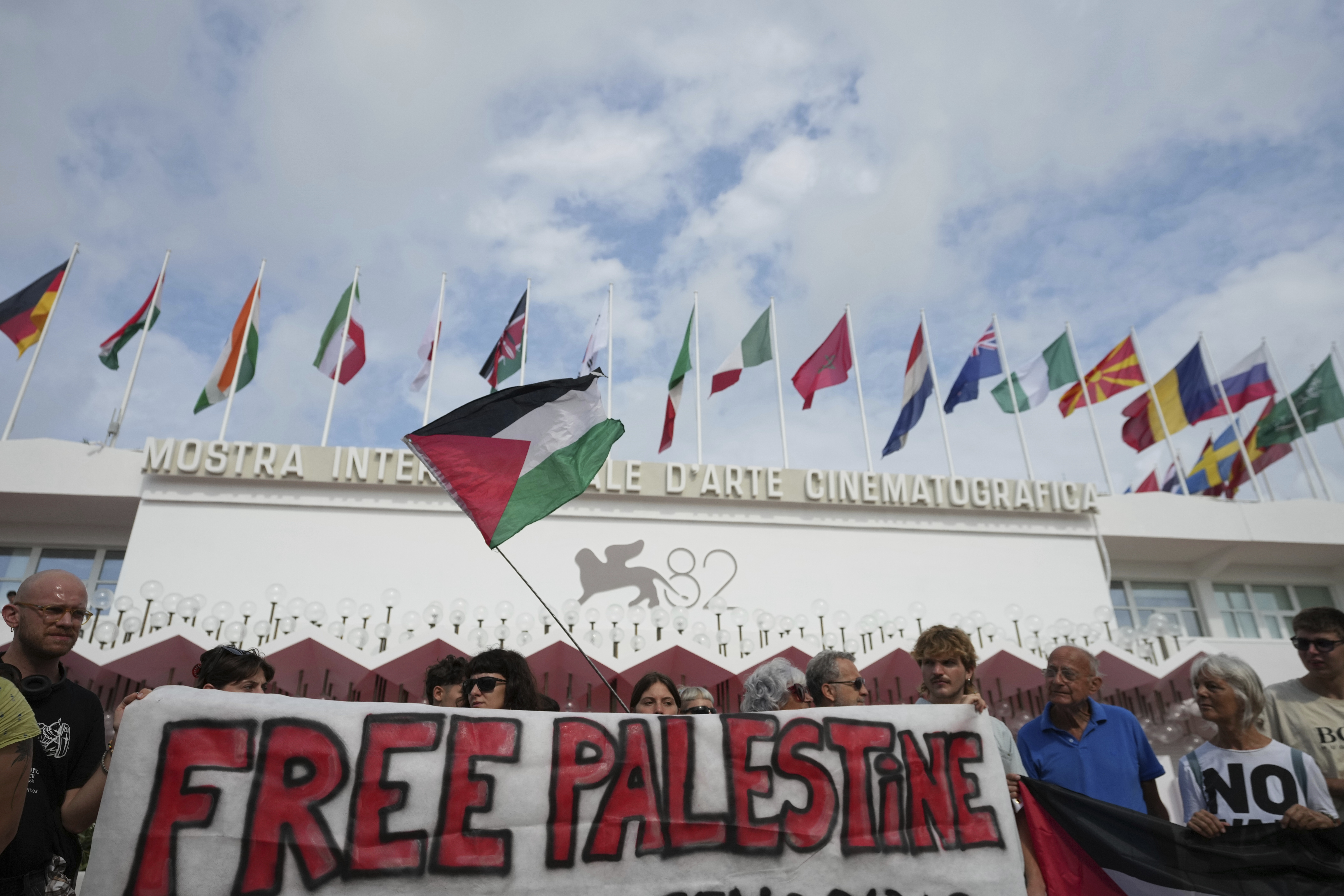 Pro Palestine demonstrators hold a press conference in front of the red carpet to announce a demonstration on Saturday, Aug. 30 during the 82nd edition of the Venice Film Festival in Venice, Italy, on Wednesday, Aug. 27, 2025. (Alessandra Tarantino - Invision)