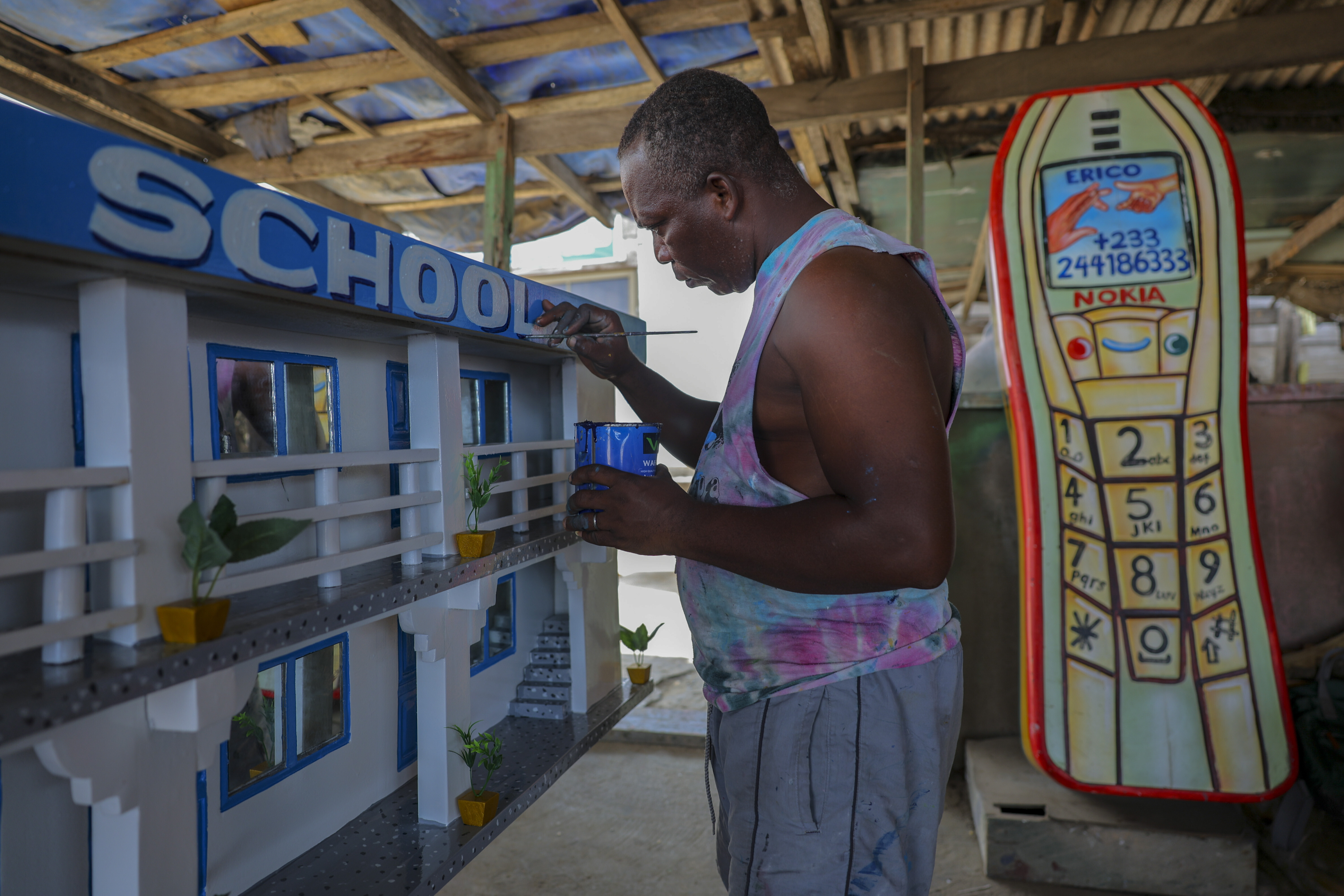 Joseph Adjetey works on a fantasy coffin at Eric Kpakpo's carpentry shop in La, Accra, Ghana, Wednesday, July 23, 2025. (Misper Apawu - AP)