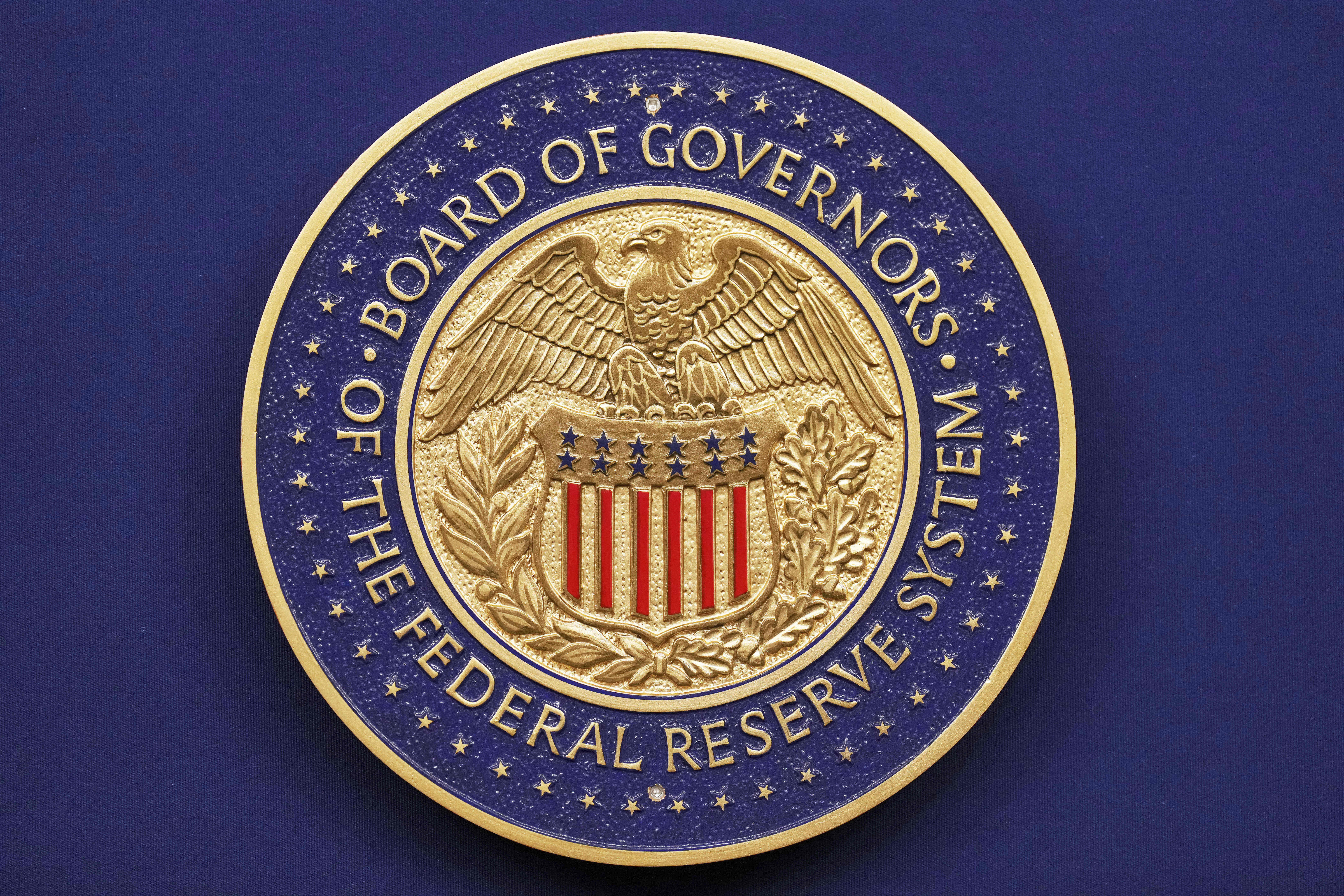 A seal is seen before Federal Reserve Chairman Jerome Powell walks out to speak during a news conference following the Federal Open Market Committee meeting, Wednesday, Sept. 17, 2025, at the Federal Reserve Board Building in Washington. (Jacquelyn Martin - AP)