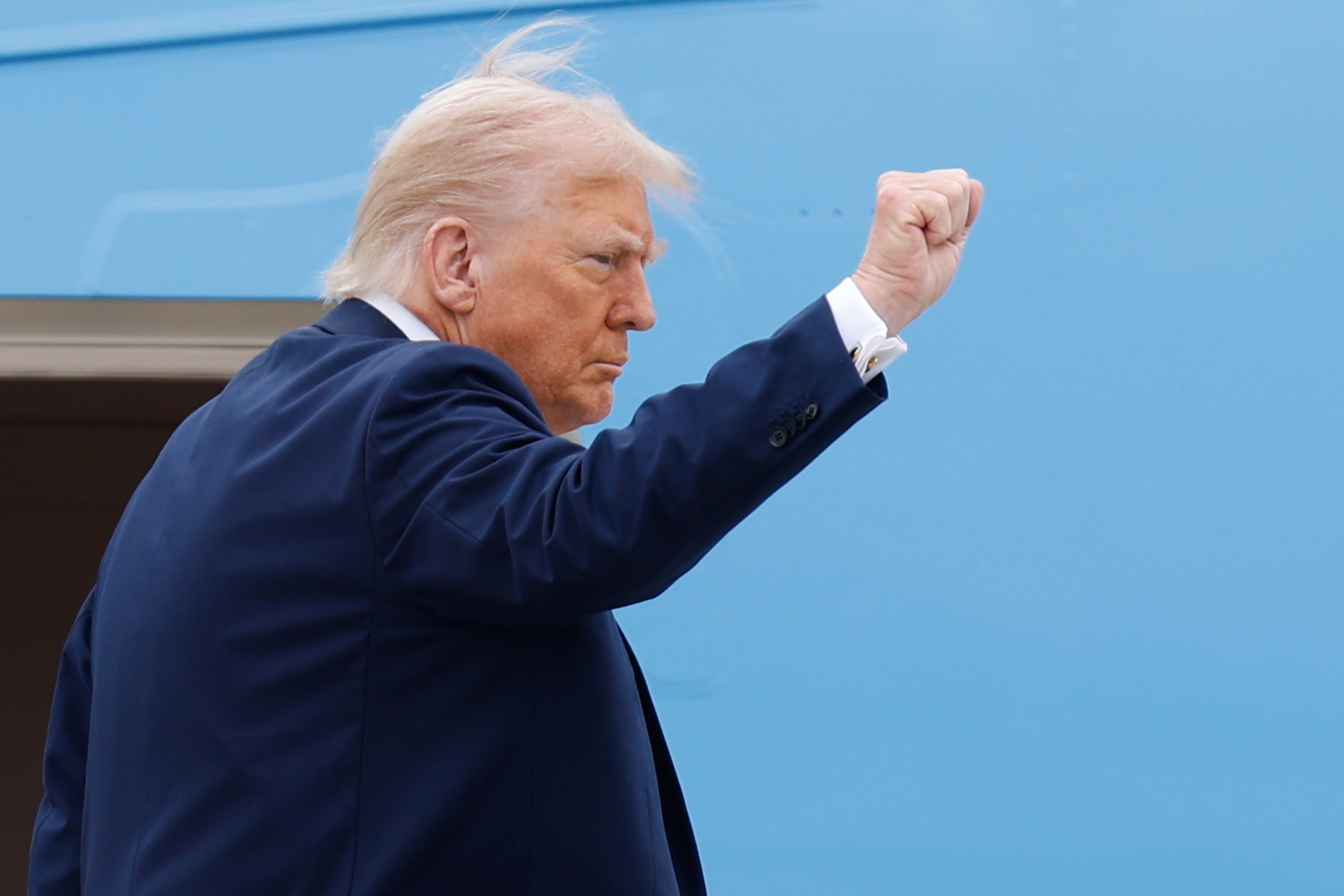 President Donald Trump gestures as he boards Air Force One at Joint Base Andrews, Md., Sunday, Sept. 21, 2025. en route to a memorial for conservative activist Charlie Kirk in Glendale, Ariz. (Luis M. Alvarez - FR596 AP)