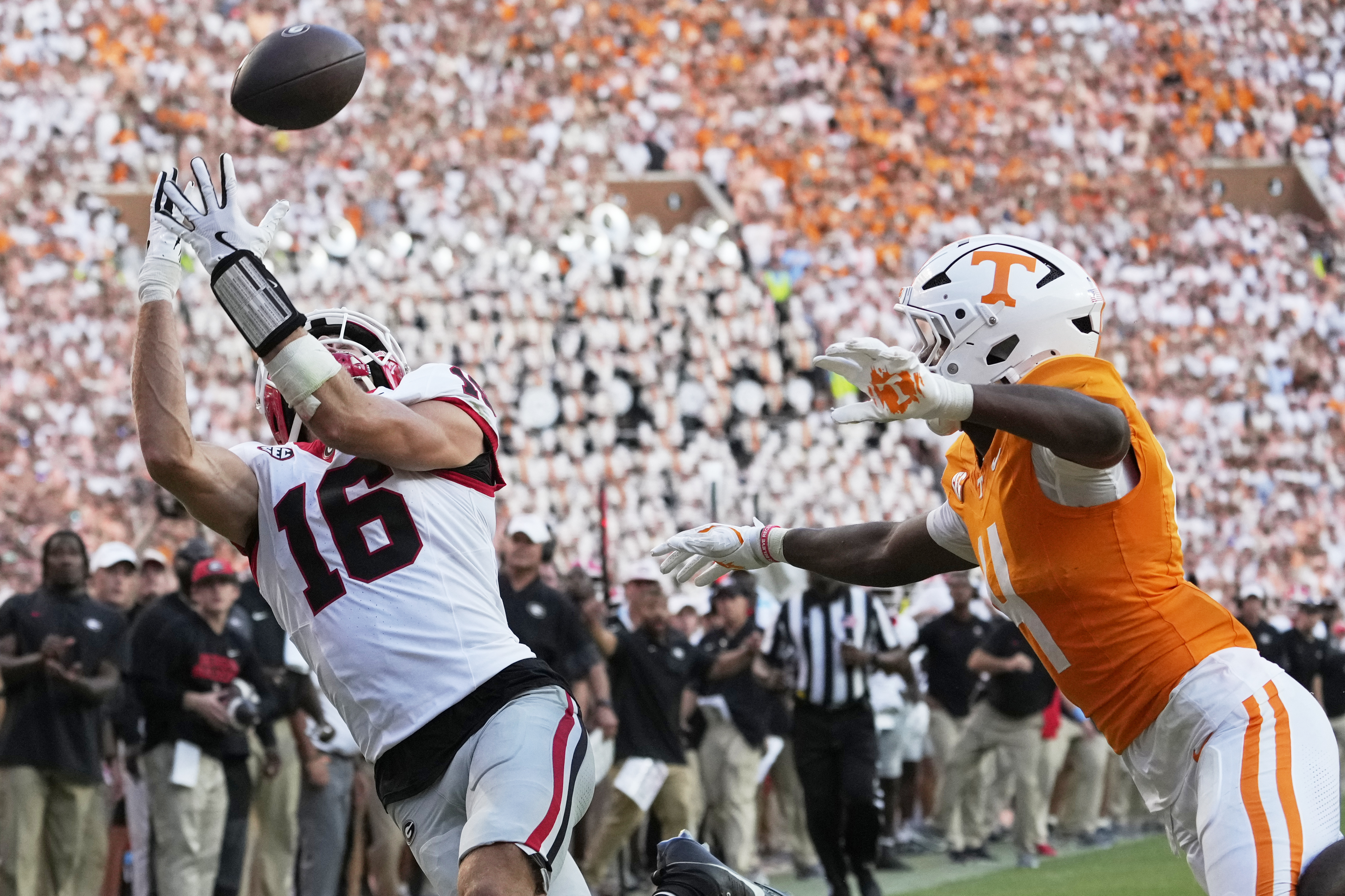 Georgia wide receiver London Humphreys (16) catches a touchdown pass over Tennessee defensive back Ty Redmond (4) during the second half of an NCAA college football game Saturday, Sept. 13, 2025, in Knoxville, Tenn. (George Walker IV - AP)