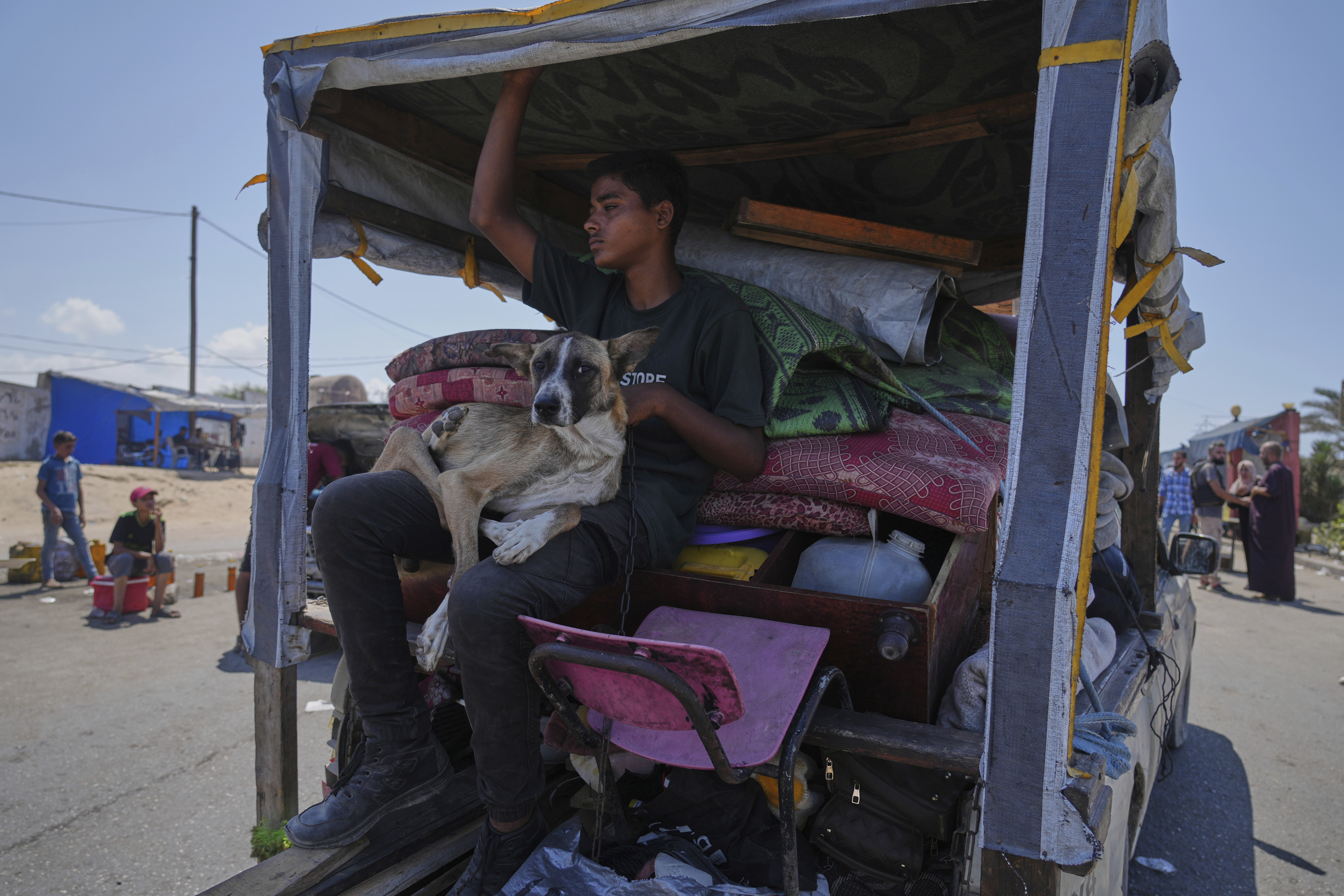 Displaced Palestinians fleeing northern Gaza carry their belongings along the coastal road toward southern Gaza, Tuesday, Sept. 9, 2025, after the Israeli army issued evacuation orders from Gaza City. (Jehad Alshrafi - AP)