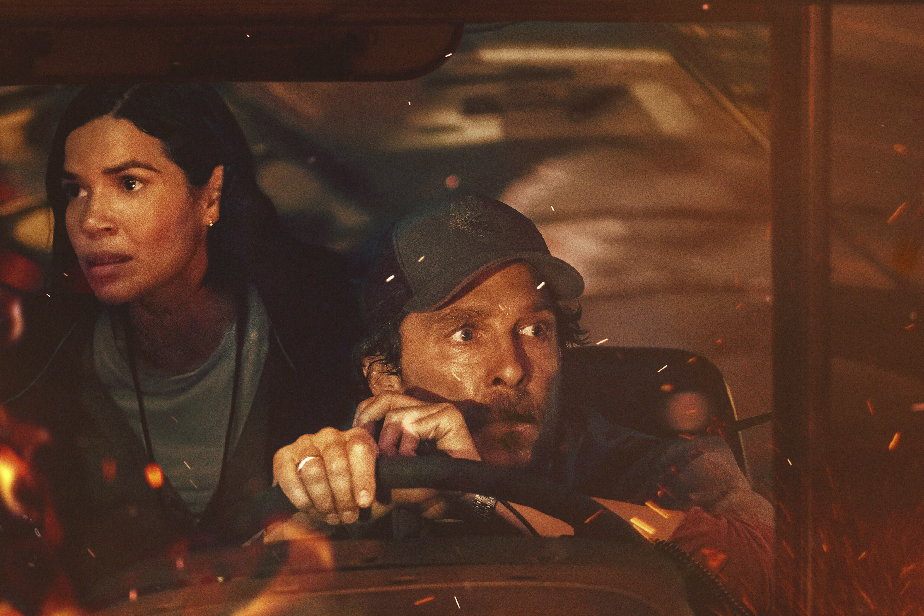 This image released by Apple TV+ shows America Ferrara, left, and Matthew McConaughey in a scene from 