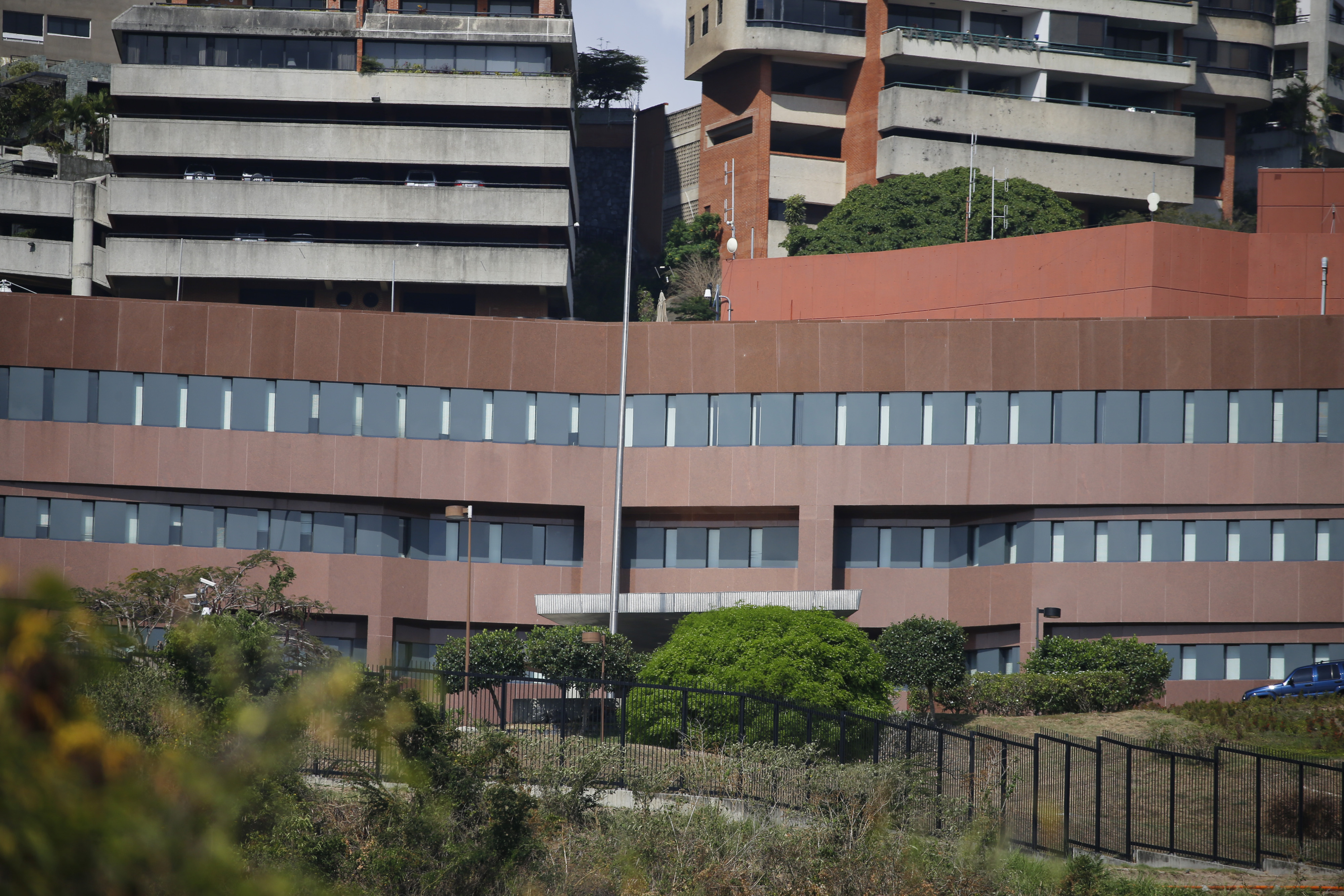 FILE - This photo show the facade of the U.S. Embassy and the flag pole without the American flag, in Caracas, Venezuela, March 14, 2019. (Fernando Llano - AP)