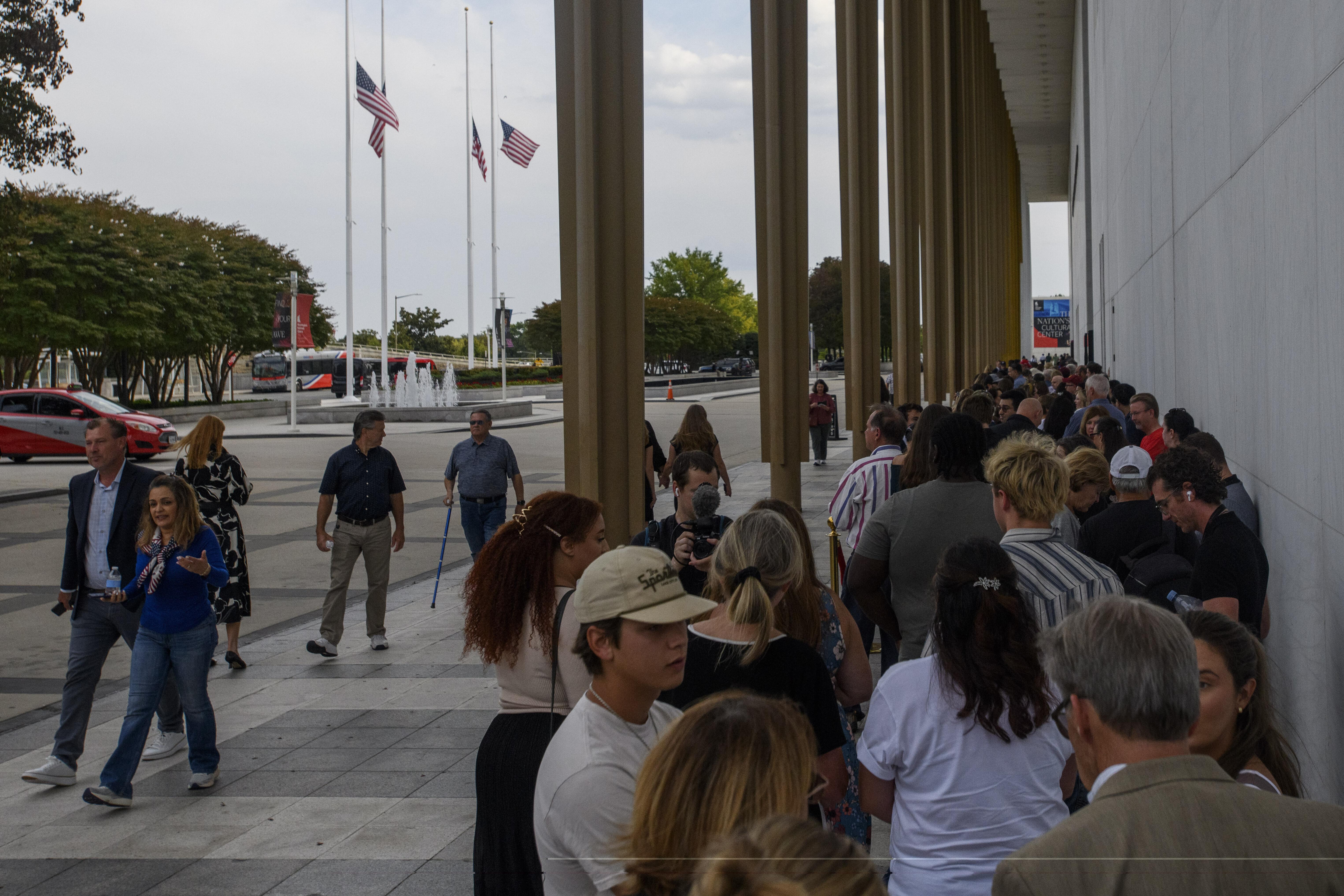 People wait in line for a memorial and prayer vigil for Charlie Kirk at the John F. Kennedy Memorial Center for the Performing Arts, Sunday, Sept. 14, 2025, in Washington. (Rod Lamkey - FR172078)