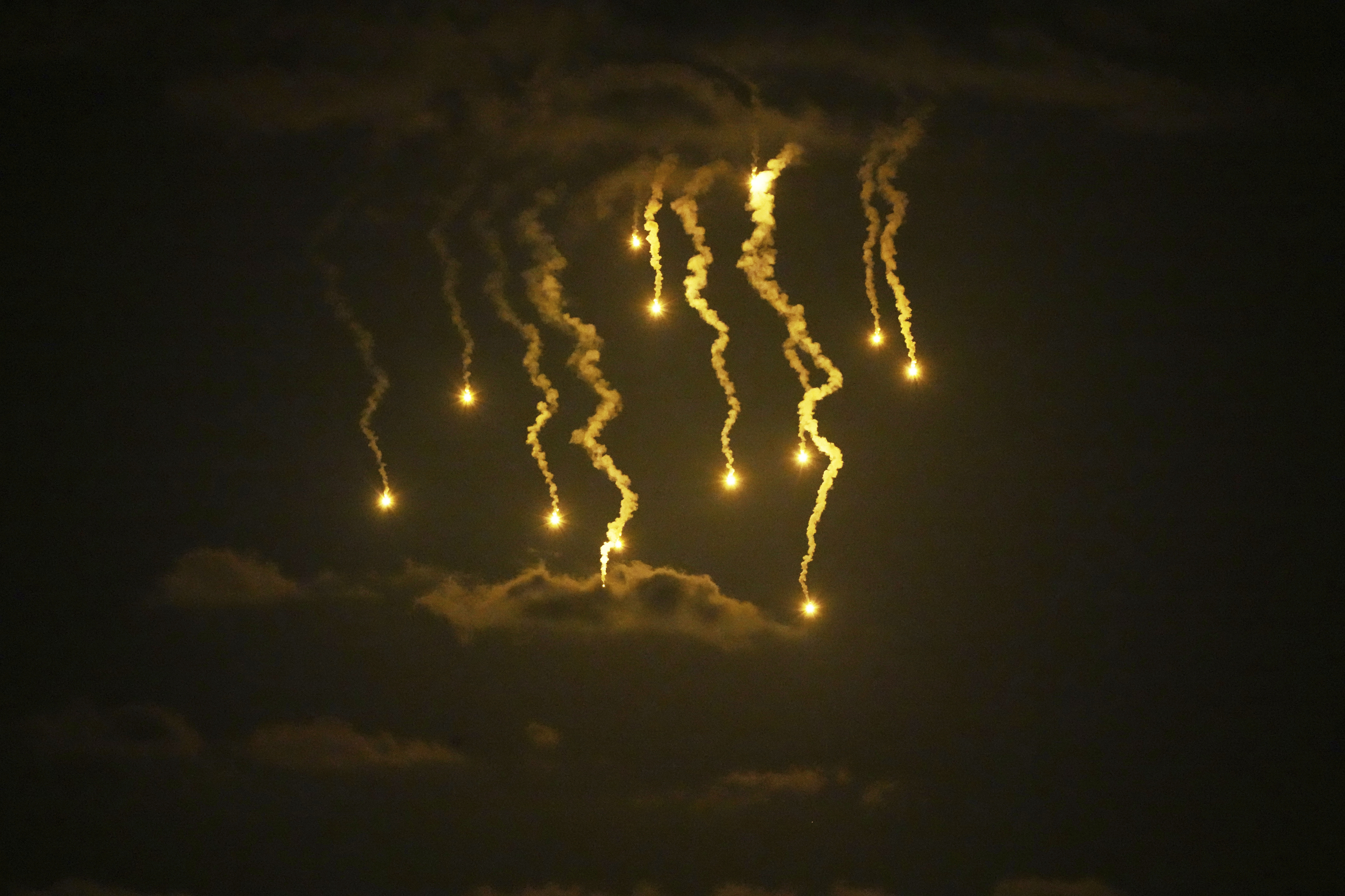 Illumination flares launched by the Israeli army are seen over Deir al-Balah in central Gaza Strip, Wednesday, Sept. 10, 2025. (Abdel Kareem Hana - AP)