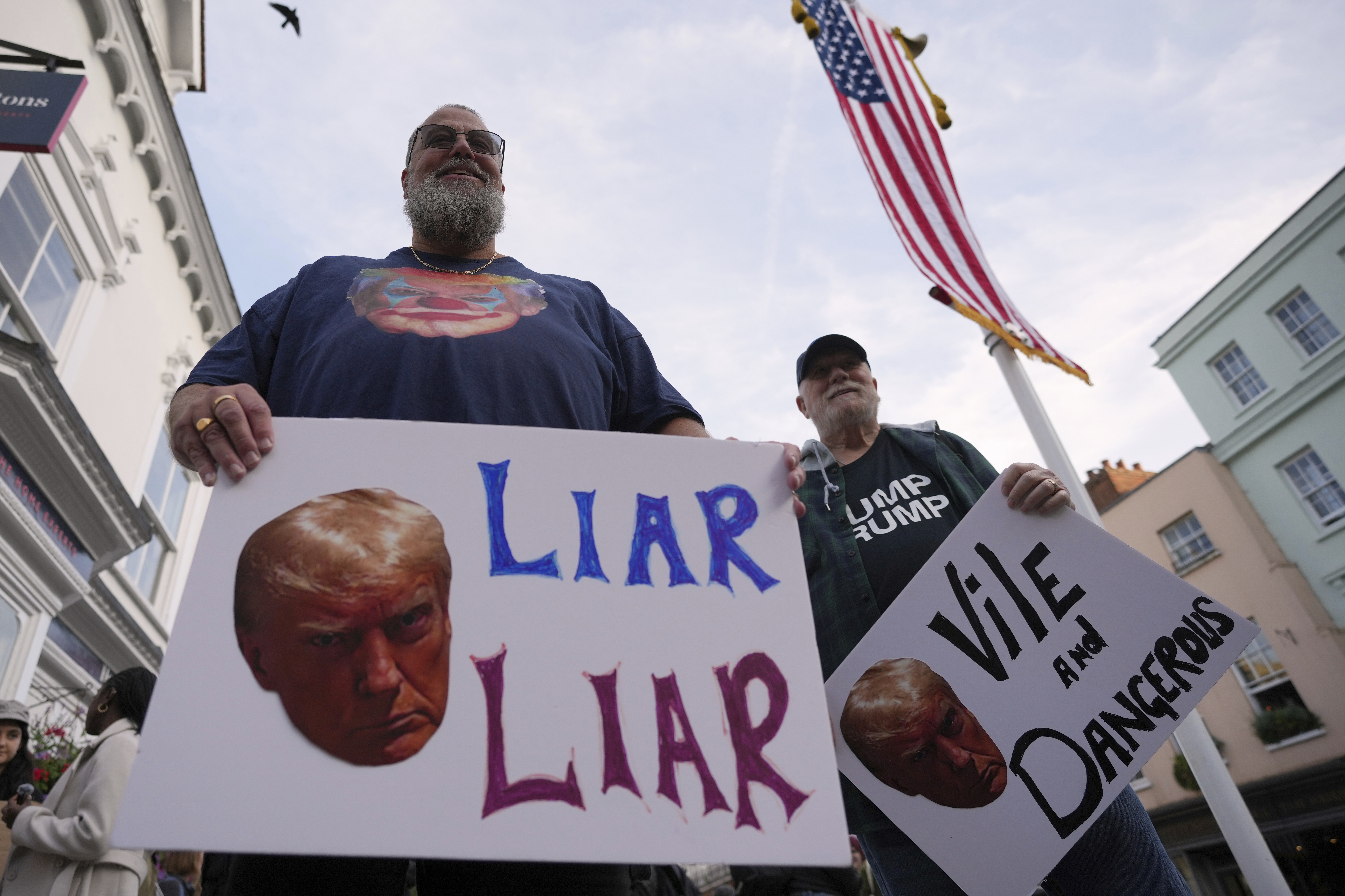 Protesters gather for a demonstration ahead of the arrival of President Donald Trump in Windsor, England, Tuesday, Sept. 16, 2025. (Kin Cheung - AP)