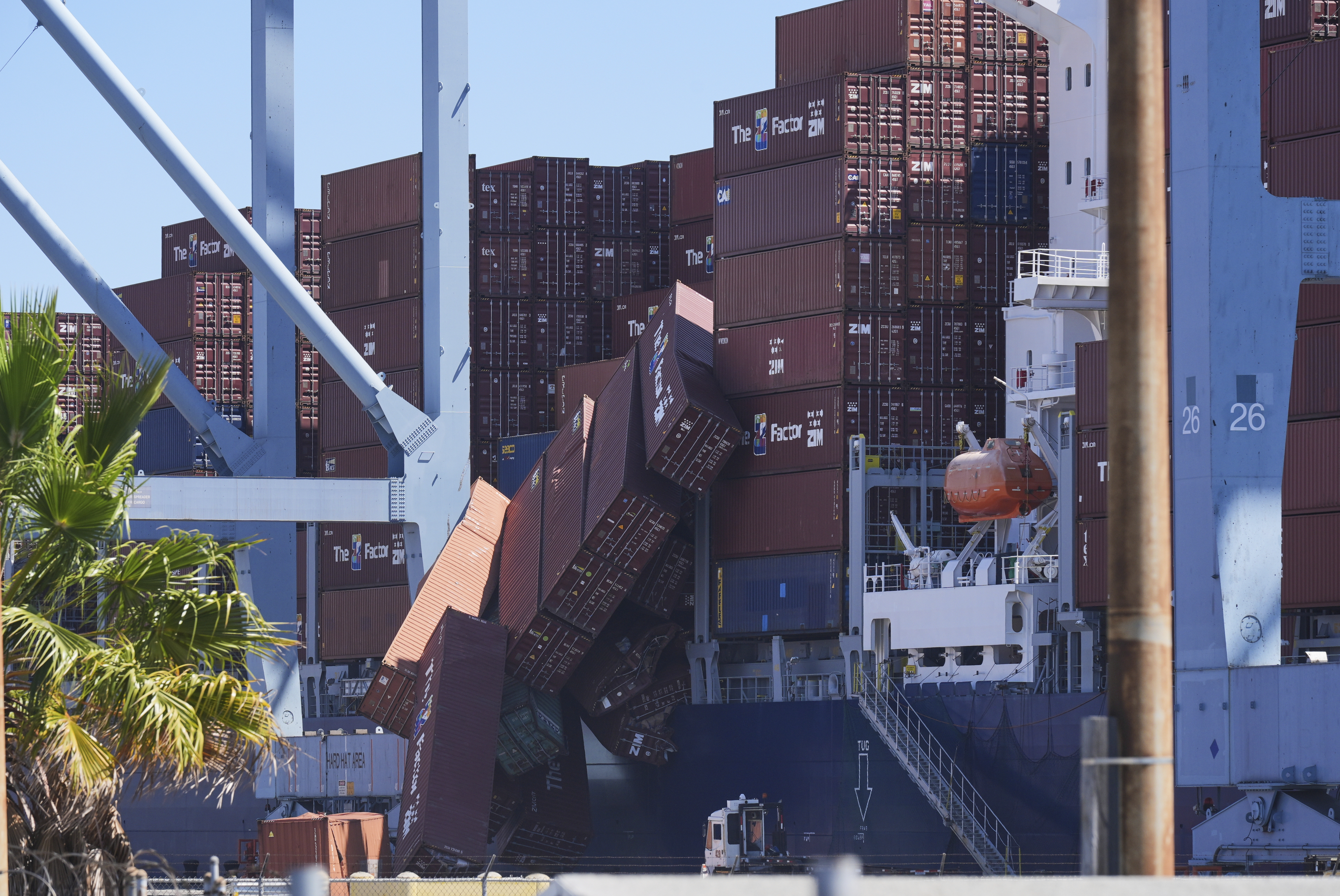 Containers topple off a cargo ship at the Port of Long Beach on Tuesday, Sept. 9, 2025, in Long Beach, Calif. (Damian Dovarganes - AP)