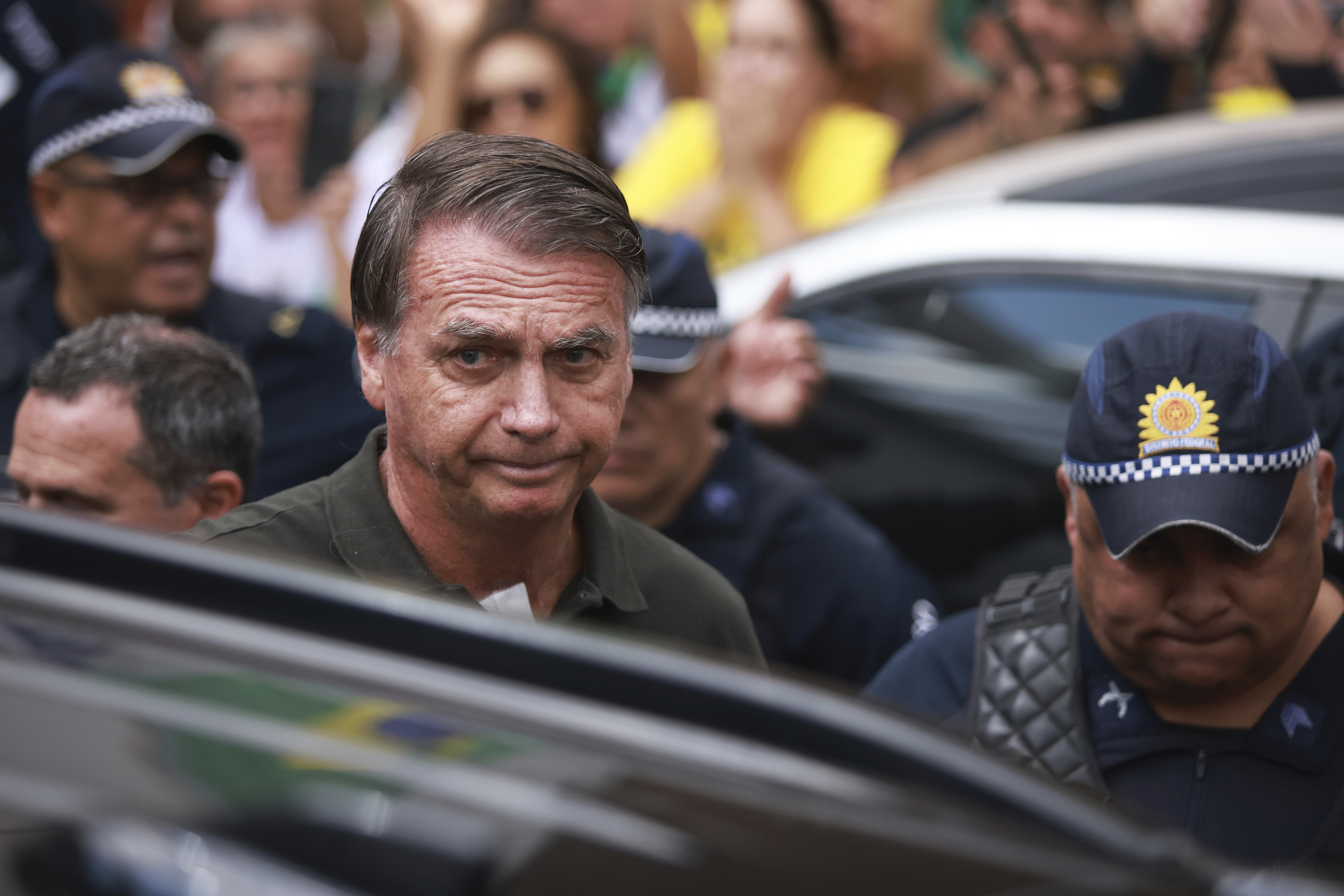 Former President Jair Bolsonaro, temporarily allowed out of house arrest for medical treatment, departs a hospital in Brasilia, Brazil, Sunday, Sep. 14, 2025. (Luis Nova - AP)