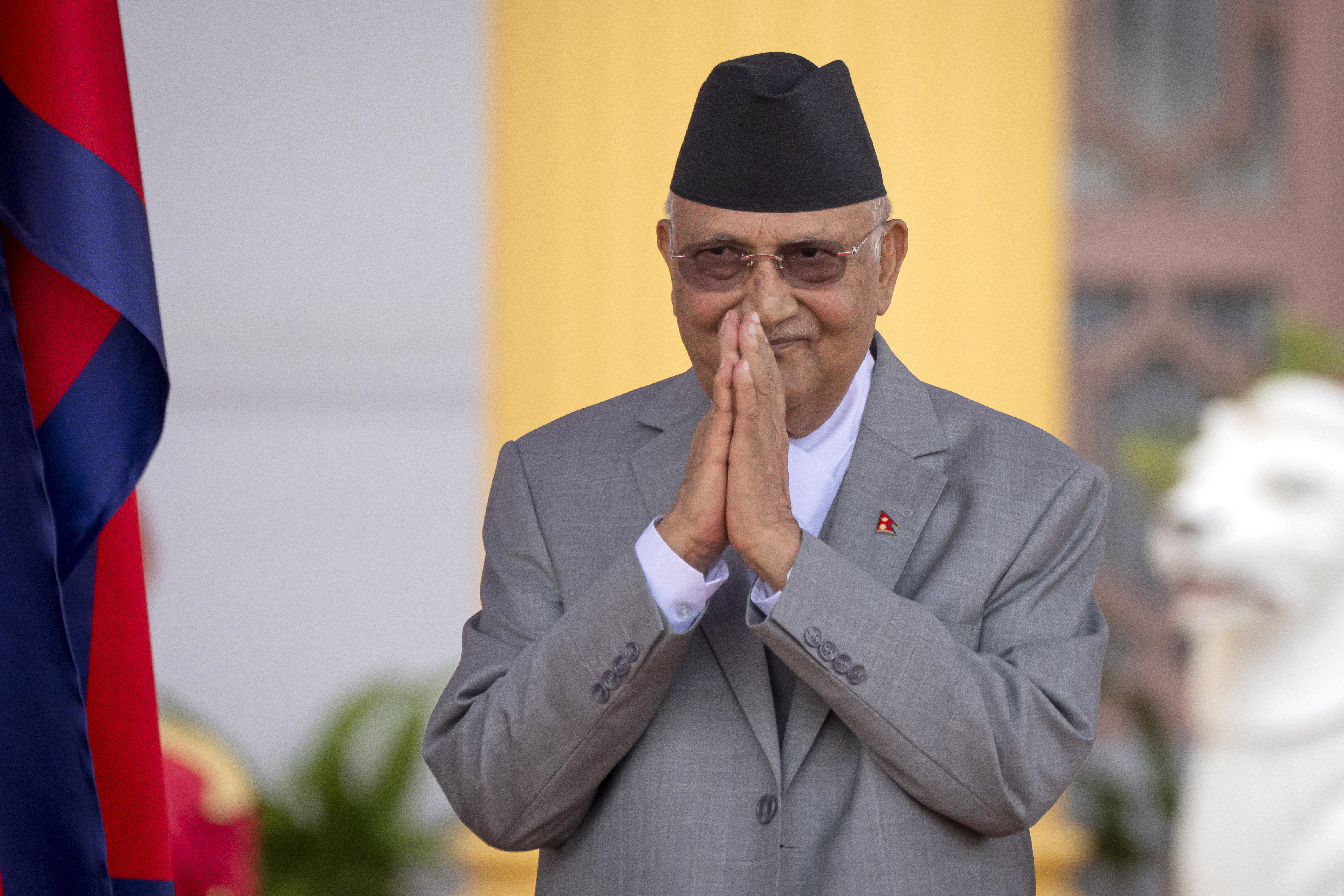FILE -The then newly elected Prime Minister Khadga Prasad Oli greets after the oath of office in President residence in Kathmandu, Nepal, July 15, 2024. (Niranjan Shrestha - AP)