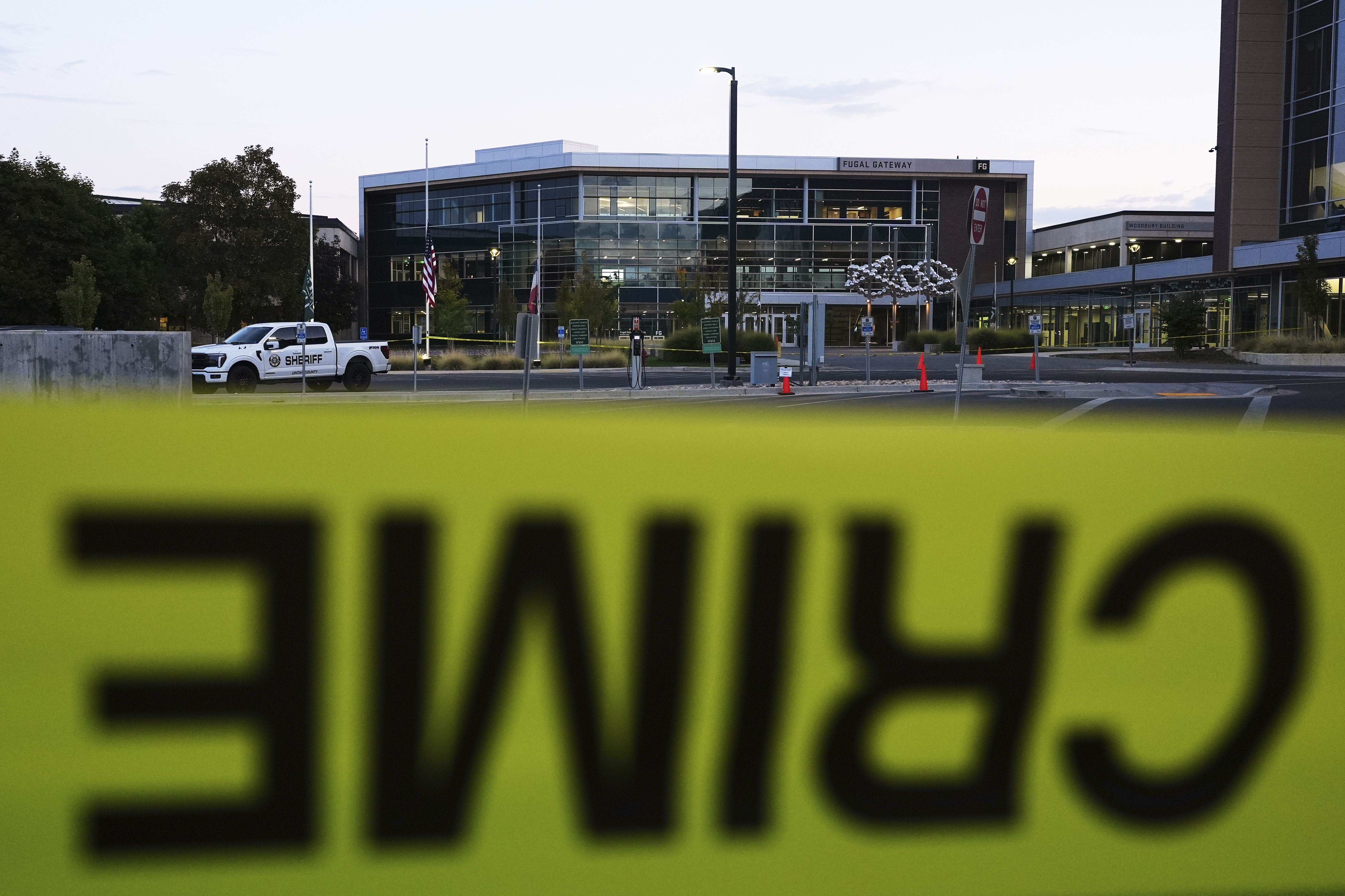 Crime scene tape surrounds Utah Valley University after Turning Point USA CEO and co-founder Charlie Kirk was shot and killed , Saturday, Sept. 13, 2025, in Orem, Utah. (Lindsey Wasson - AP)