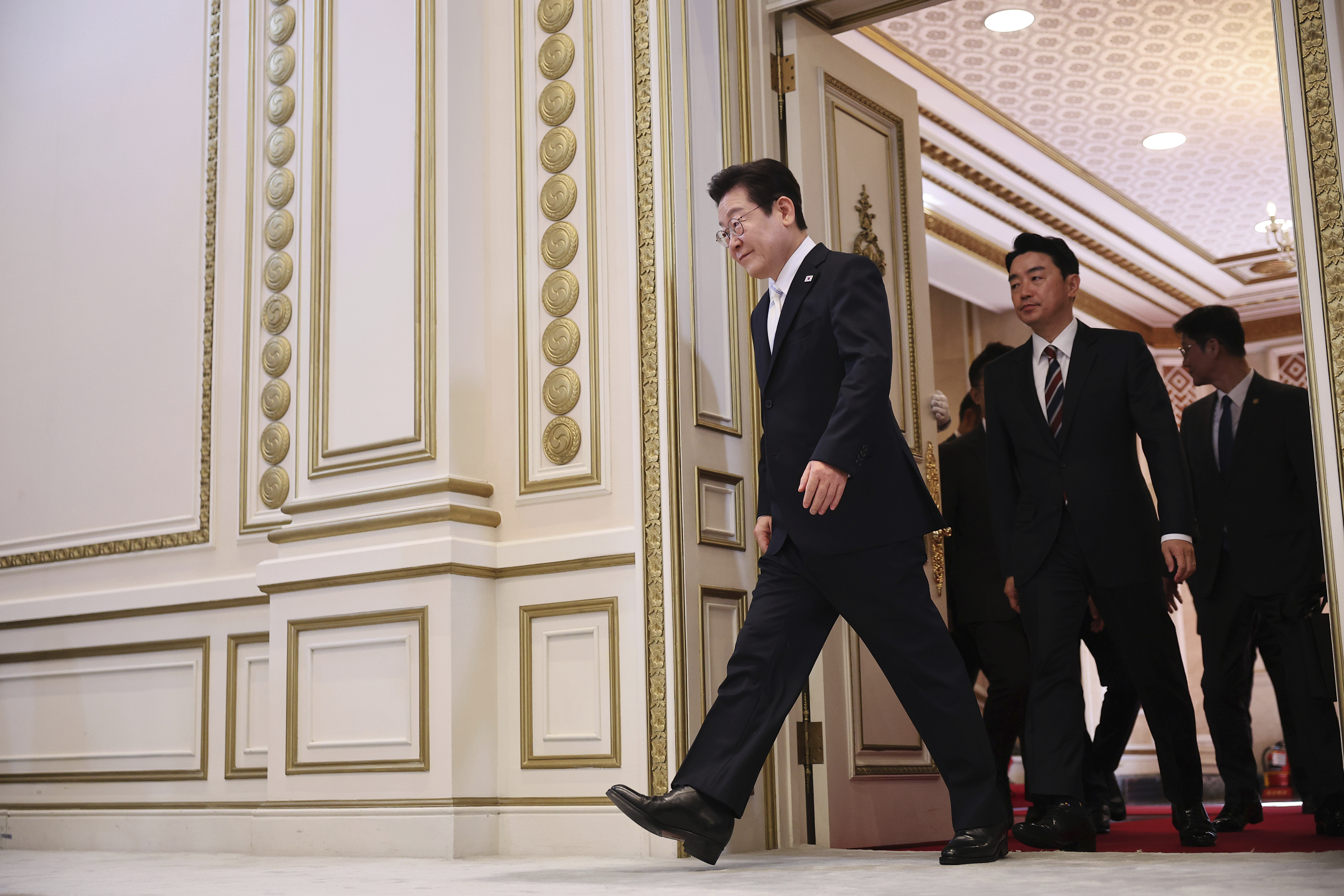 South Korean President Lee Jae Myung arrives for his news conference to mark 100 days in office at the Blue House in Seoul, South Korea, Sept, 11, 2025. (Kim Hong-Ji - Pool Reuters)