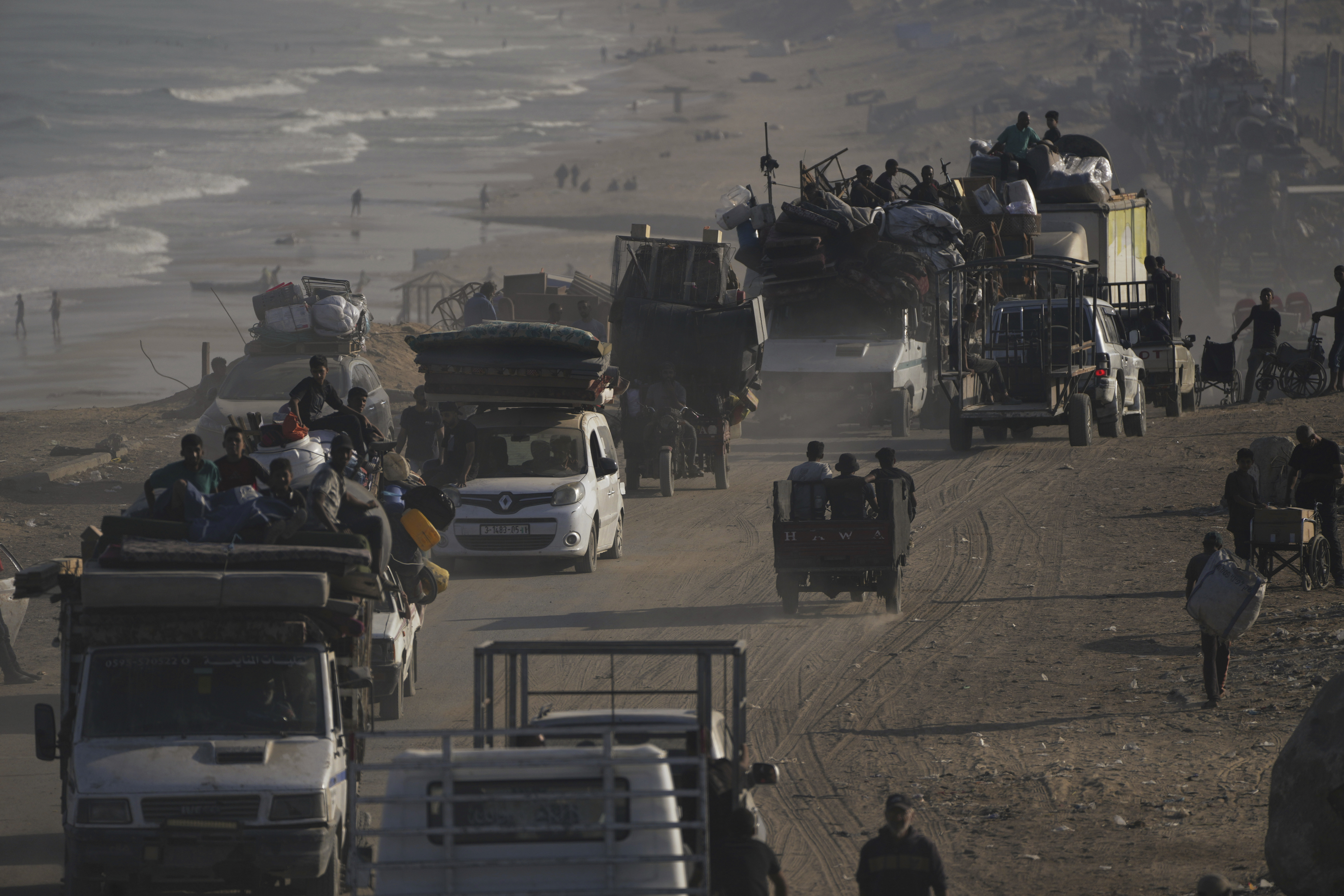 Displaced Palestinians flee Gaza City by foot and vehicles, carrying their belongings along the coastal road toward southern Gaza, Wednesday, Sept. 17, 2025. (Abdel Kareem Hana - AP)