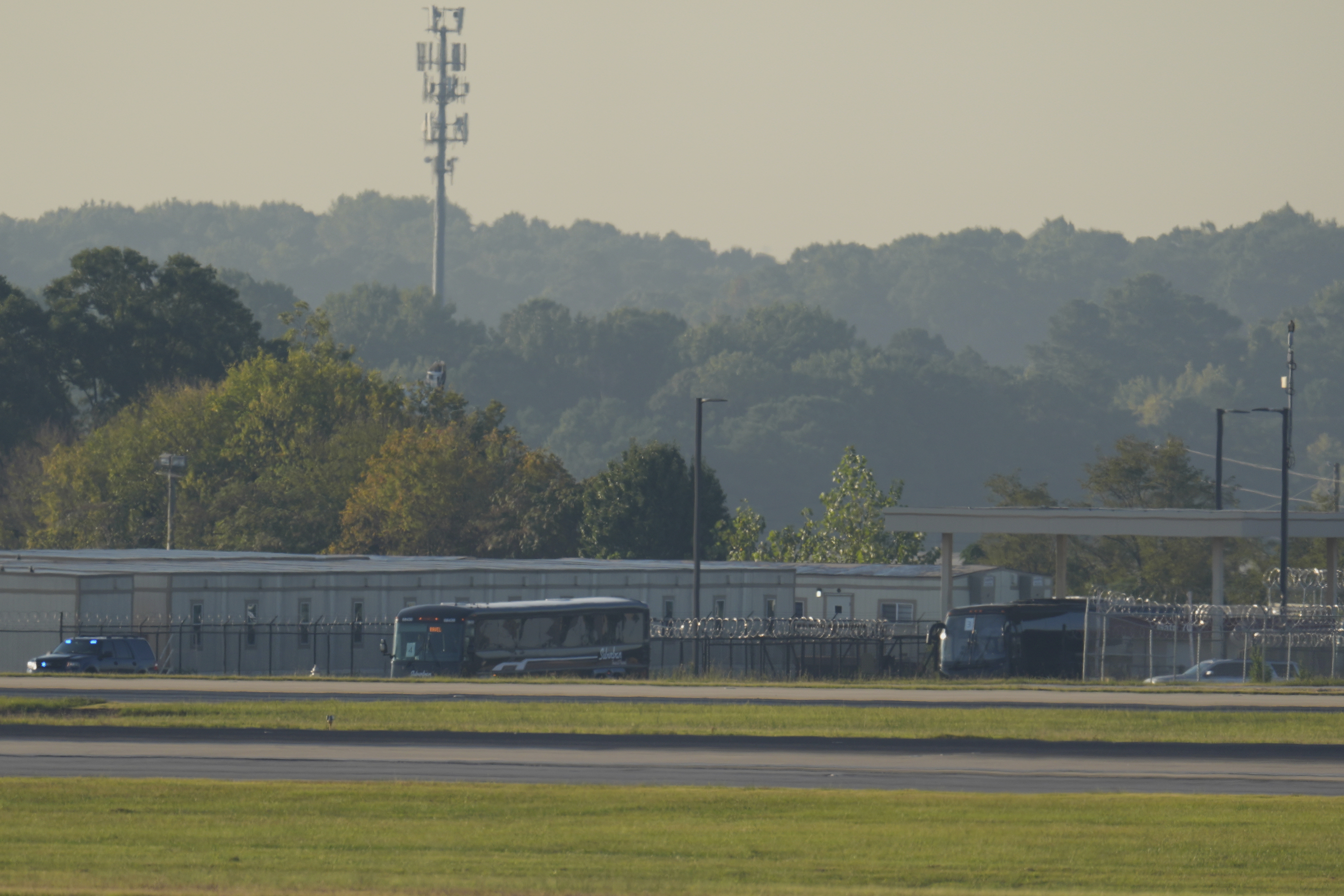Buses carrying Korean workers detained arrives at Hartsfield-Jackson International Airport in Atlanta, Thursday, Sept. 11, 2025. (George Walker IV - AP)