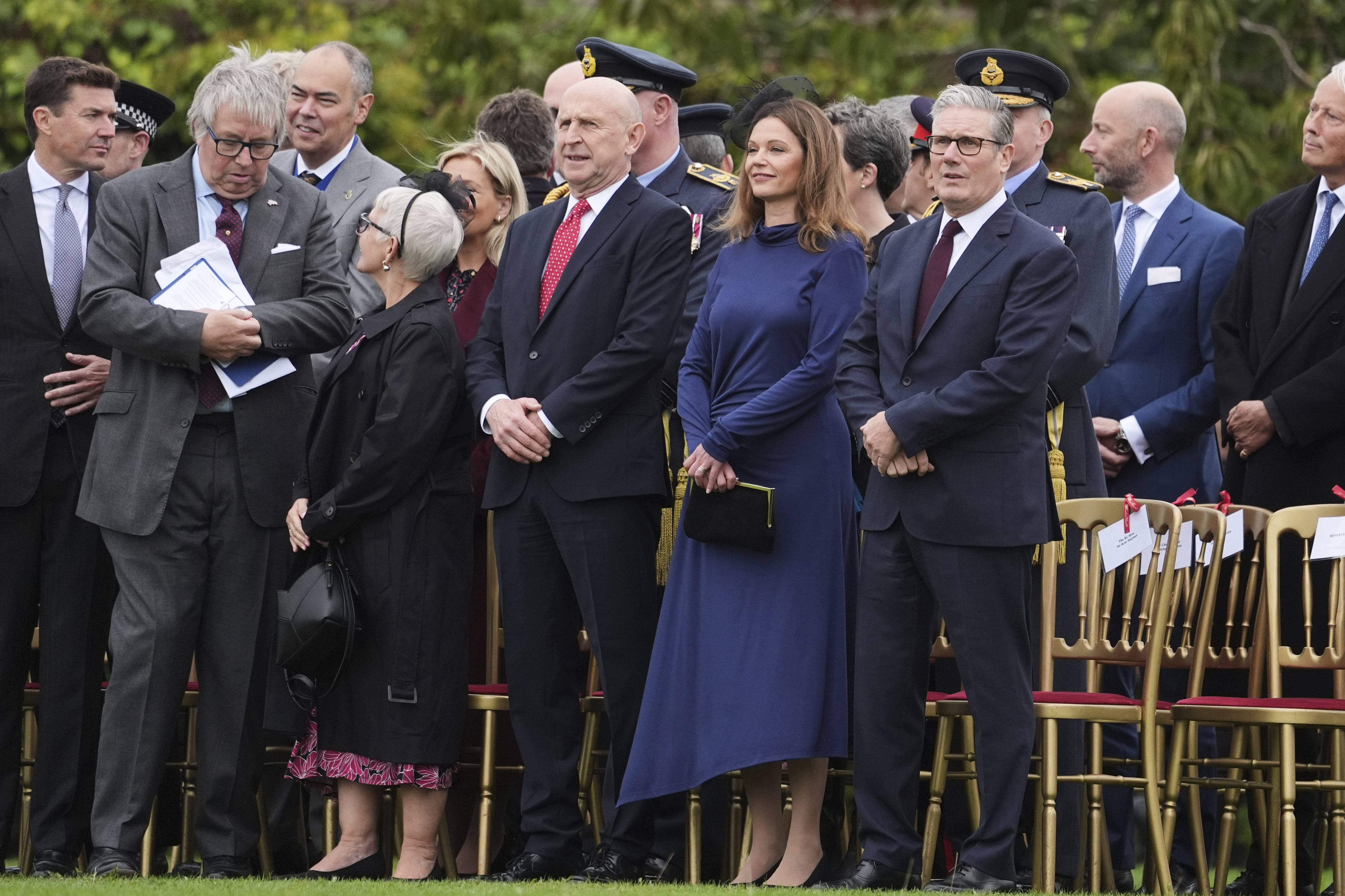From front right, Britain's Prime Minister Keir Starmer, his wife Victoria Starmer and Britain's Defense Secretary John Healey take their places to watch a Beating Retreat musical performance on the East Lawn of Windsor Castle, in Windsor, England, Wednesday, Sept. 17, 2025. (Evan Vucci - AP)