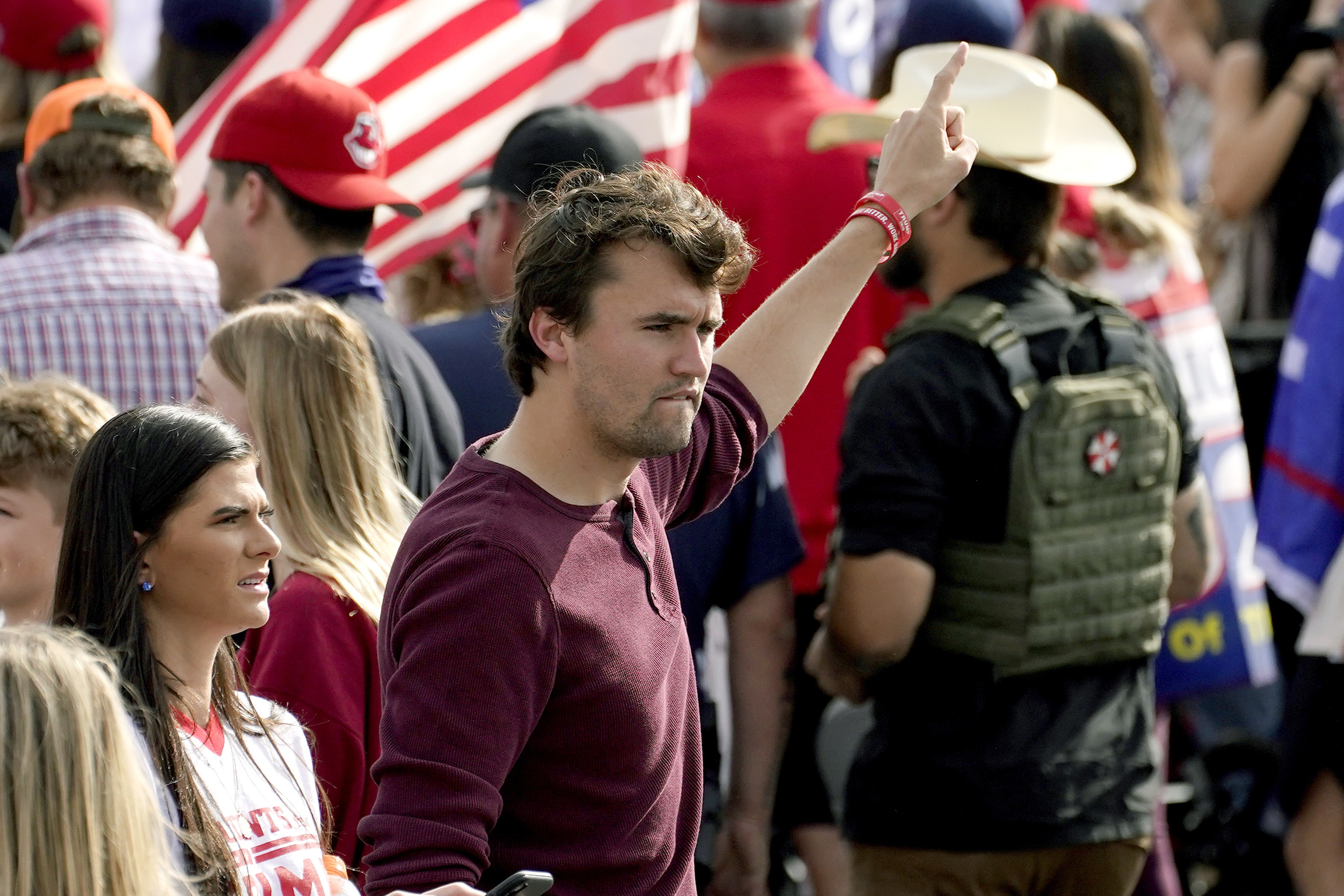 FILE - Charlie Kirk, conservative activist and founder of Turning Point USA, walks through the crowd at a pro Trump rally outside the Maricopa County Recorder's Office where elections officials continue to count ballots, Friday, Nov. 6, 2020, in Phoenix. (Matt York - AP)