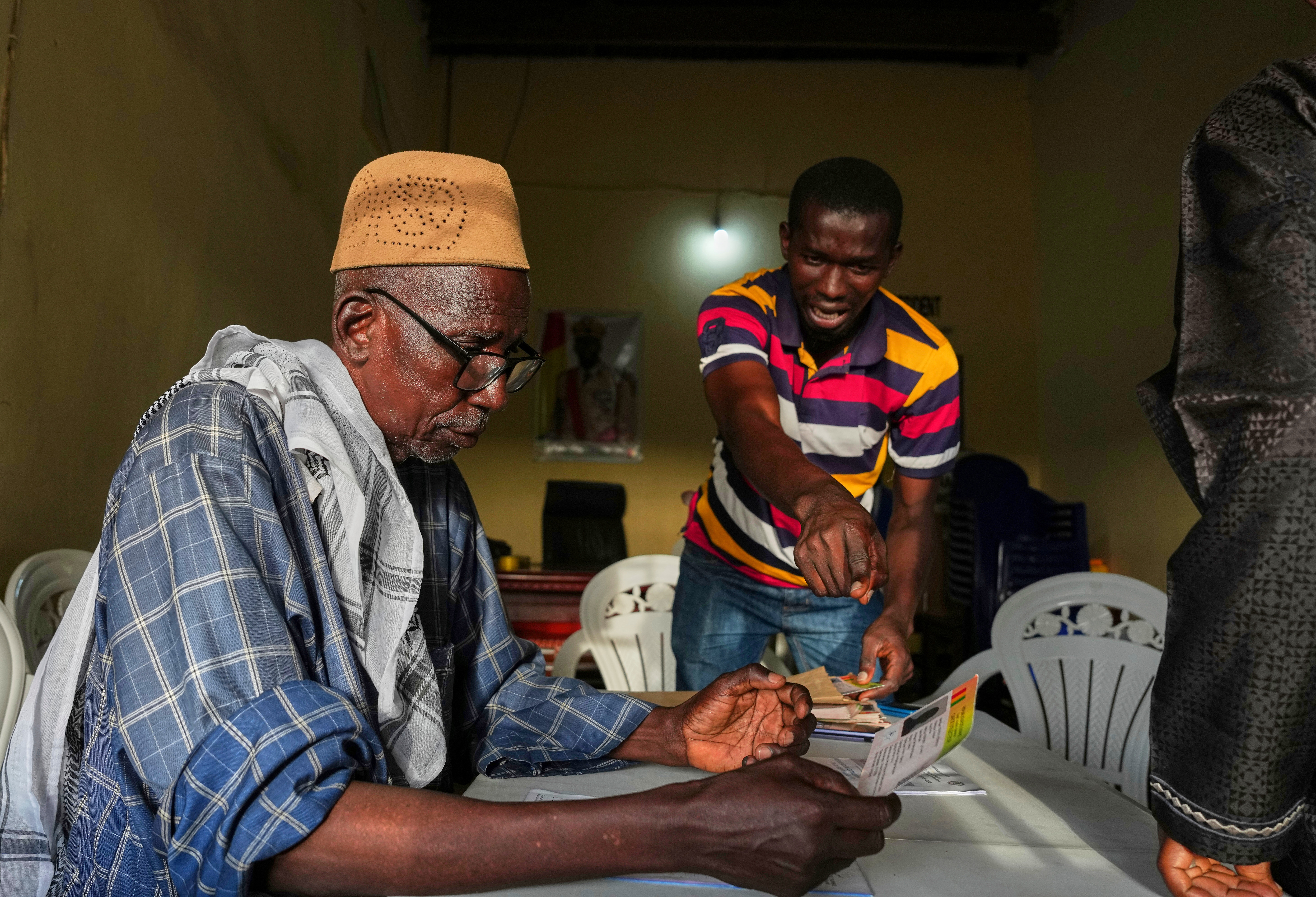 Officials work at a polling station during the constitutional referendum in Conakry, Guinea, Sunday, Sept. 21, 2025. (Misper Apawu - AP)