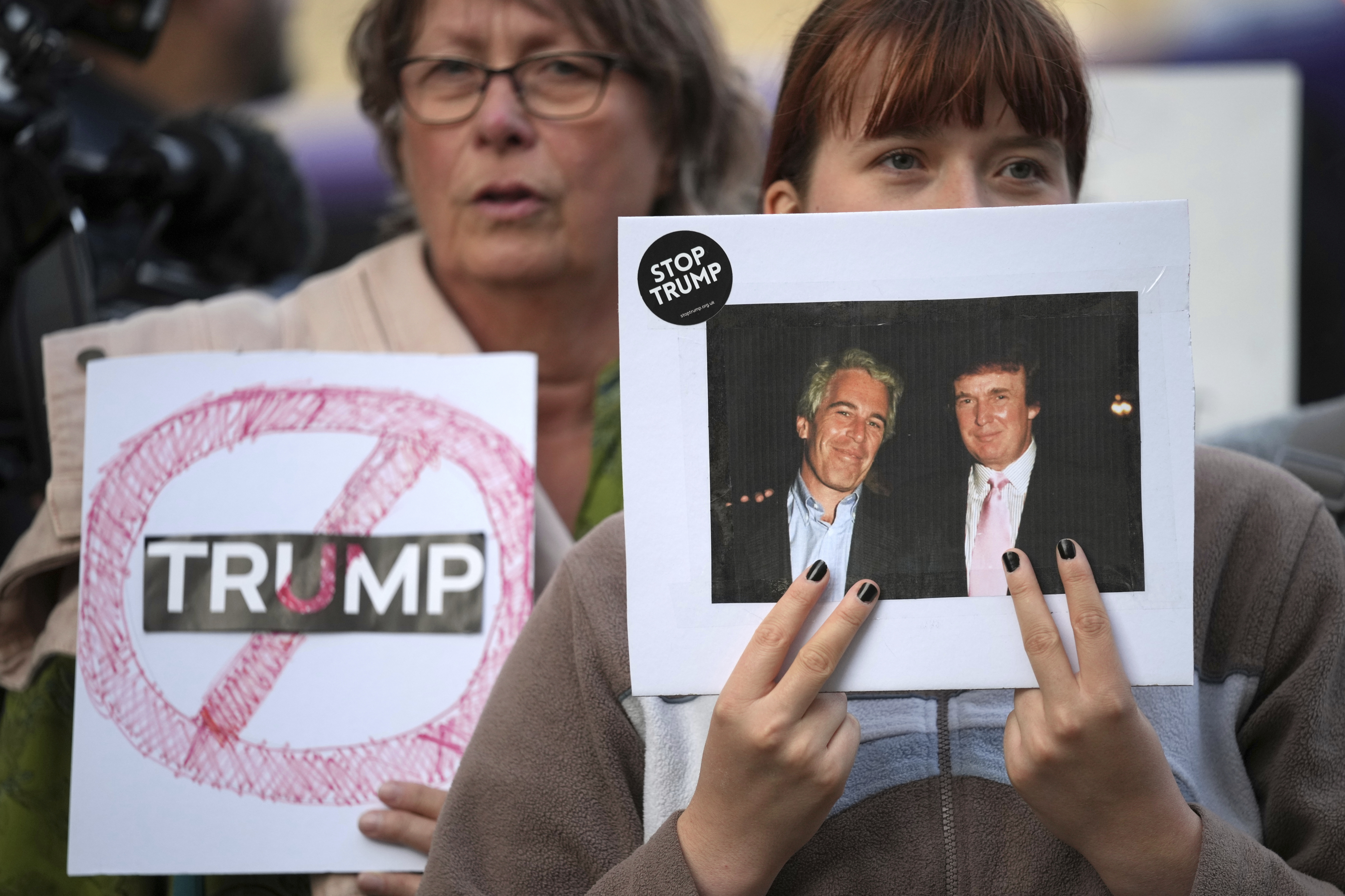 Protesters gather for a demonstration ahead of the arrival of President Donald Trump in Windsor, England, Tuesday, Sept. 16, 2025. (Kin Cheung - AP)