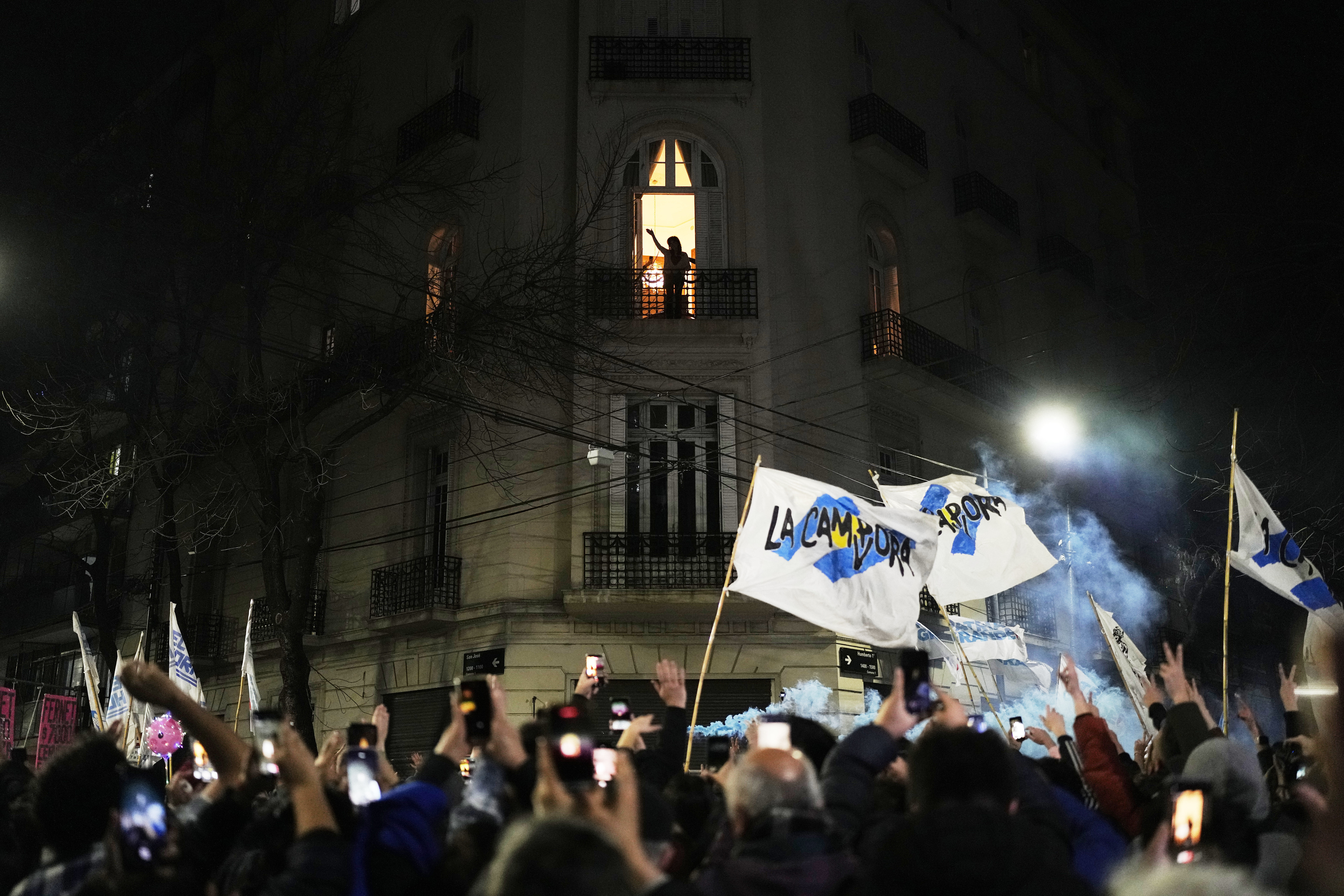 Former President Cristina Fernandez waves to supporters from the balcony of her home where she is serving a six-year house arrest sentence for corruption, after legislative provincial election polls closed, in Buenos Aires, Argentina, Sunday, Sept. 7, 2025. (Natacha Pisarenko - AP)